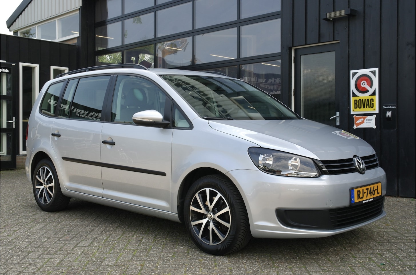 Volkswagen Touran - 1.6 TDI Comfortline BlueMotion 7p. | Cruise | Trekhaak | Navi | Trekhaak - AutoWereld.nl
