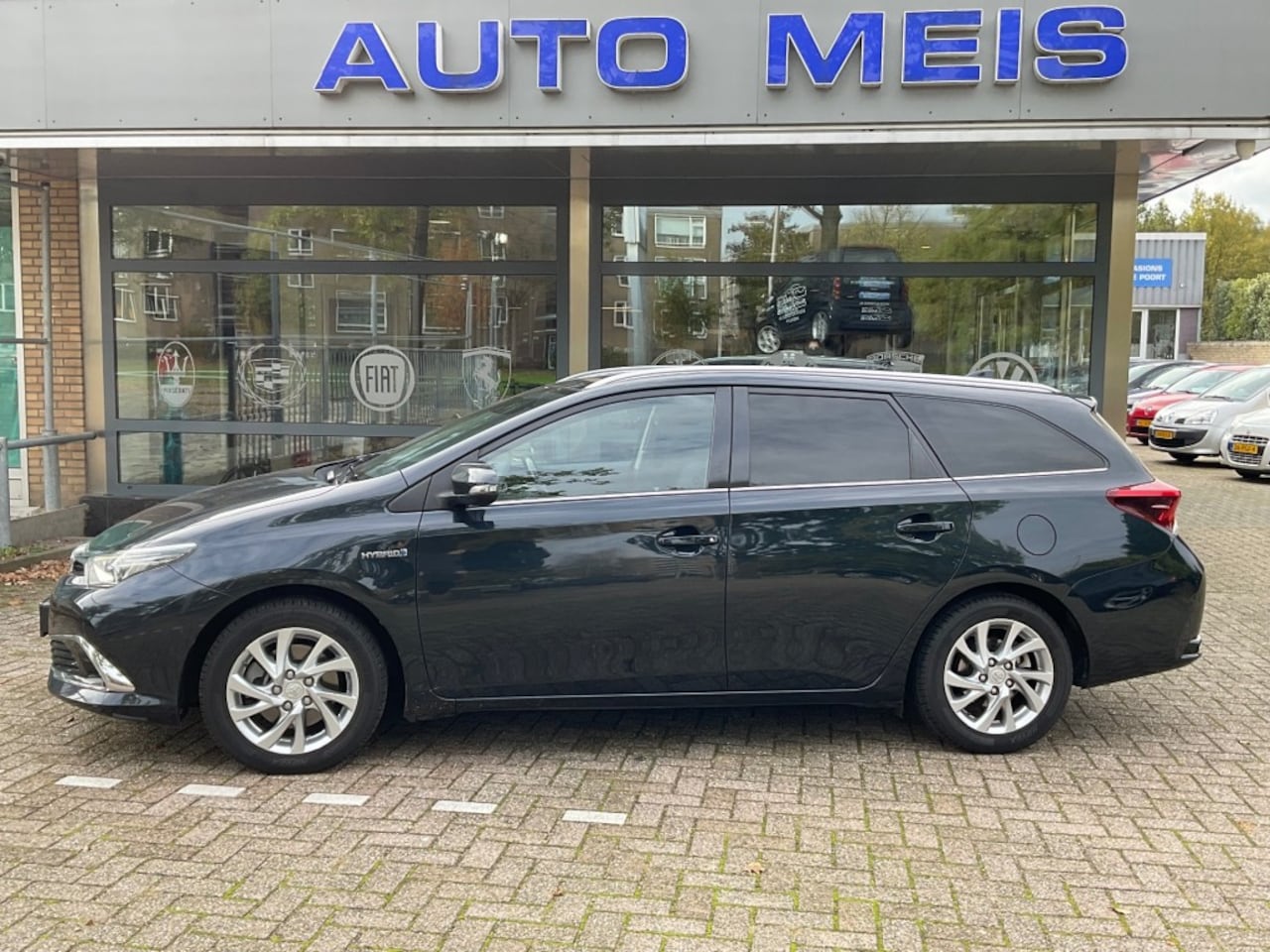 Toyota Auris - 1.8 Hybrid Lease Pro Navi Panoramadak - AutoWereld.nl