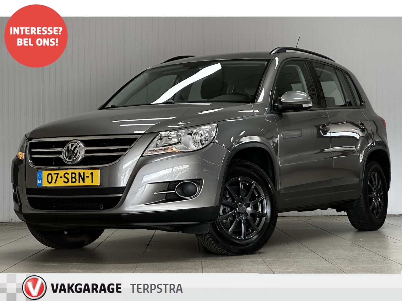 Volkswagen Tiguan - 1.4 TSI Comfort&Design/ Trekhaak!/ 16''LMV/ Clima/ Navi/ Cruise/ Bluetooth/ LEDER.Stuur/ E - AutoWereld.nl