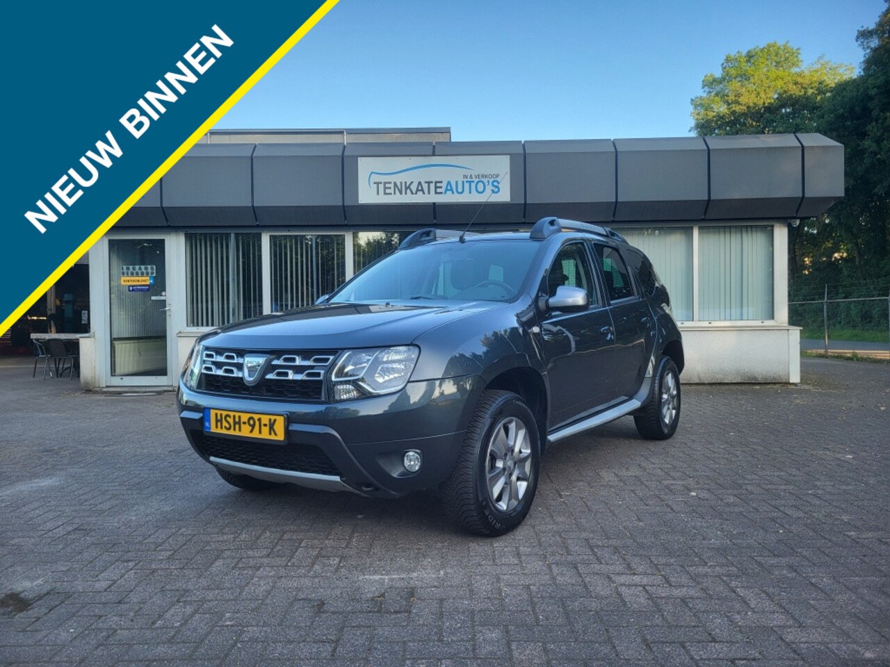Dacia Duster - 1.6 Lauréate 2wd LPG G3 Airco Navi Lichtmetaal Trekhaak Lederen - AutoWereld.nl