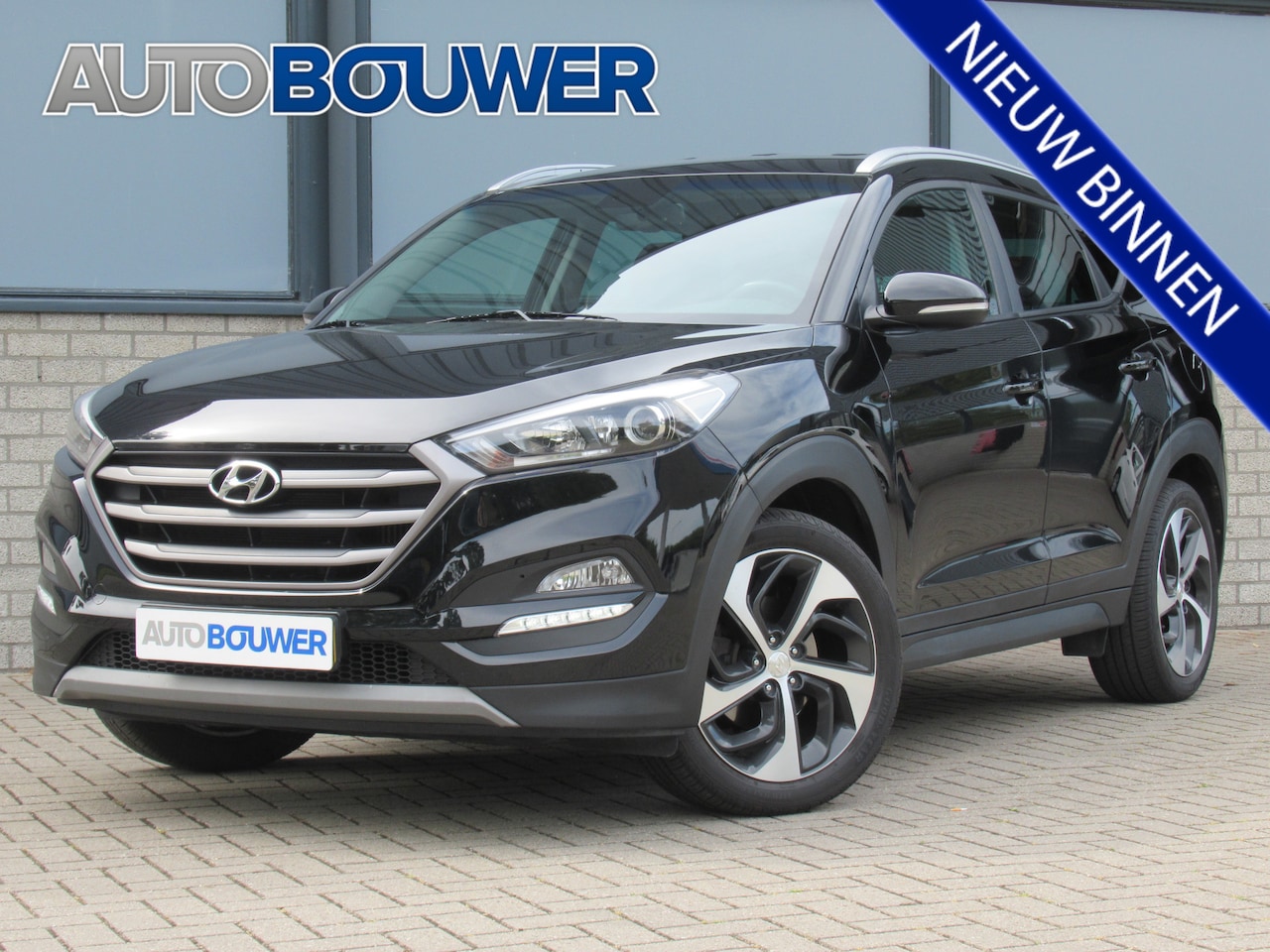 Hyundai Tucson - 1.6 T-GDI 177 PK Automaat 2e eigen | dealer onderh | Leder | tr.haak | navi | 19"inch - AutoWereld.nl
