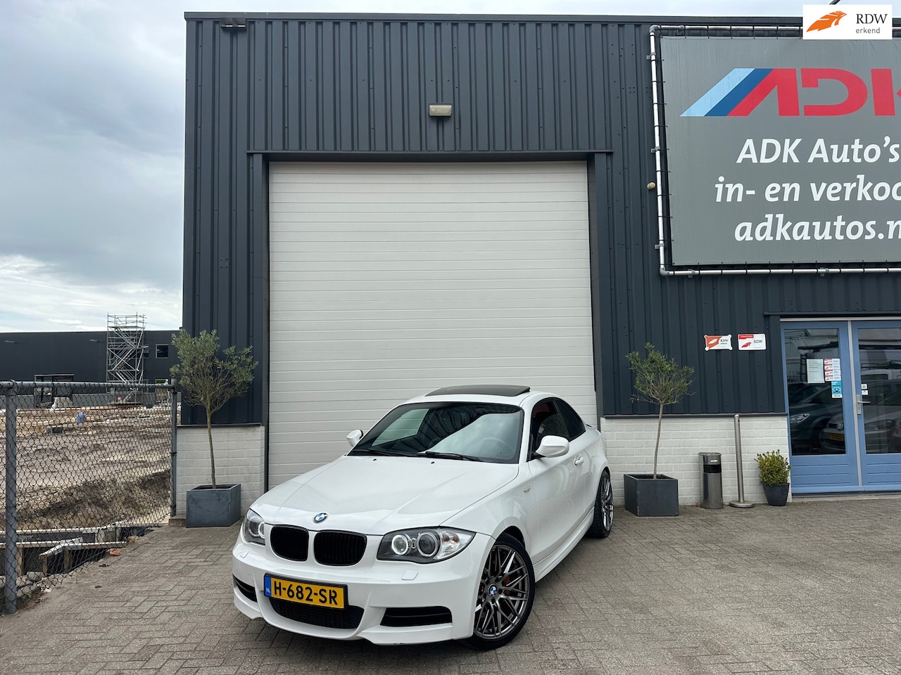 BMW 1-serie Coupé - 135i High Executive SCHUIFDAK/LEDER/XENON/18'/450PK - AutoWereld.nl