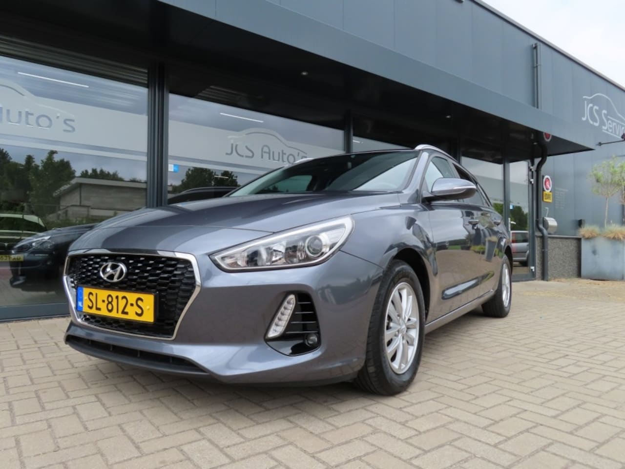 Hyundai i30 - 1.4 T-GDI Aut. Ecc Cruise Navi Trekhaak Pdc 2018 - AutoWereld.nl
