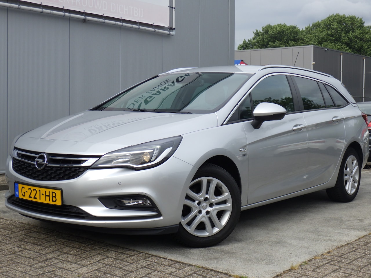 Opel Astra Sports Tourer - 1.0 Turbo 120 Jaar Edition 1.0 Turbo 120 Jaar Edition, Cruise, Navi, PDC! - AutoWereld.nl