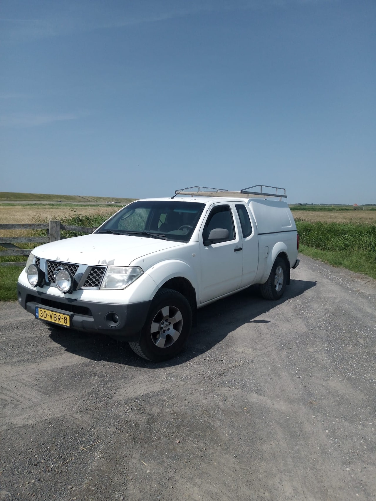 Nissan Navara - 2.5 dCi SE King Cab - AutoWereld.nl