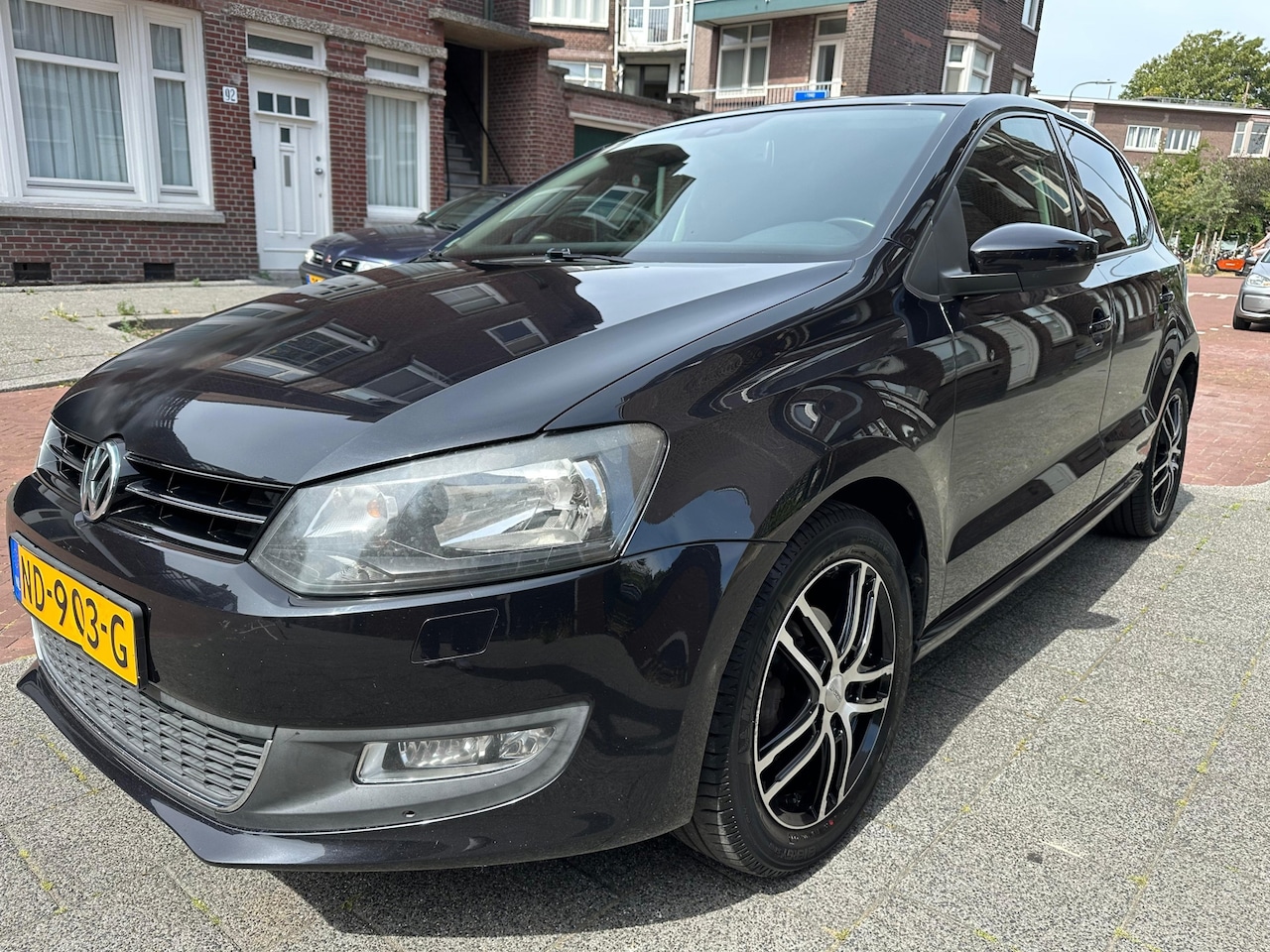 Volkswagen Polo - 1.2-12V BlueMotion Trendline Airco Cruise Navi PDC LMV Nette Auto - AutoWereld.nl