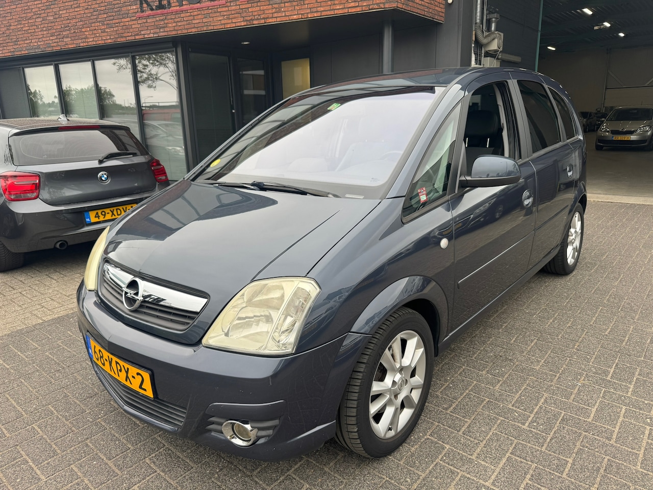 Opel Meriva - 1.6-16V Cosmo AUTOMAAT CLIMA HALF LEDER PARKEERSENSOREN - AutoWereld.nl