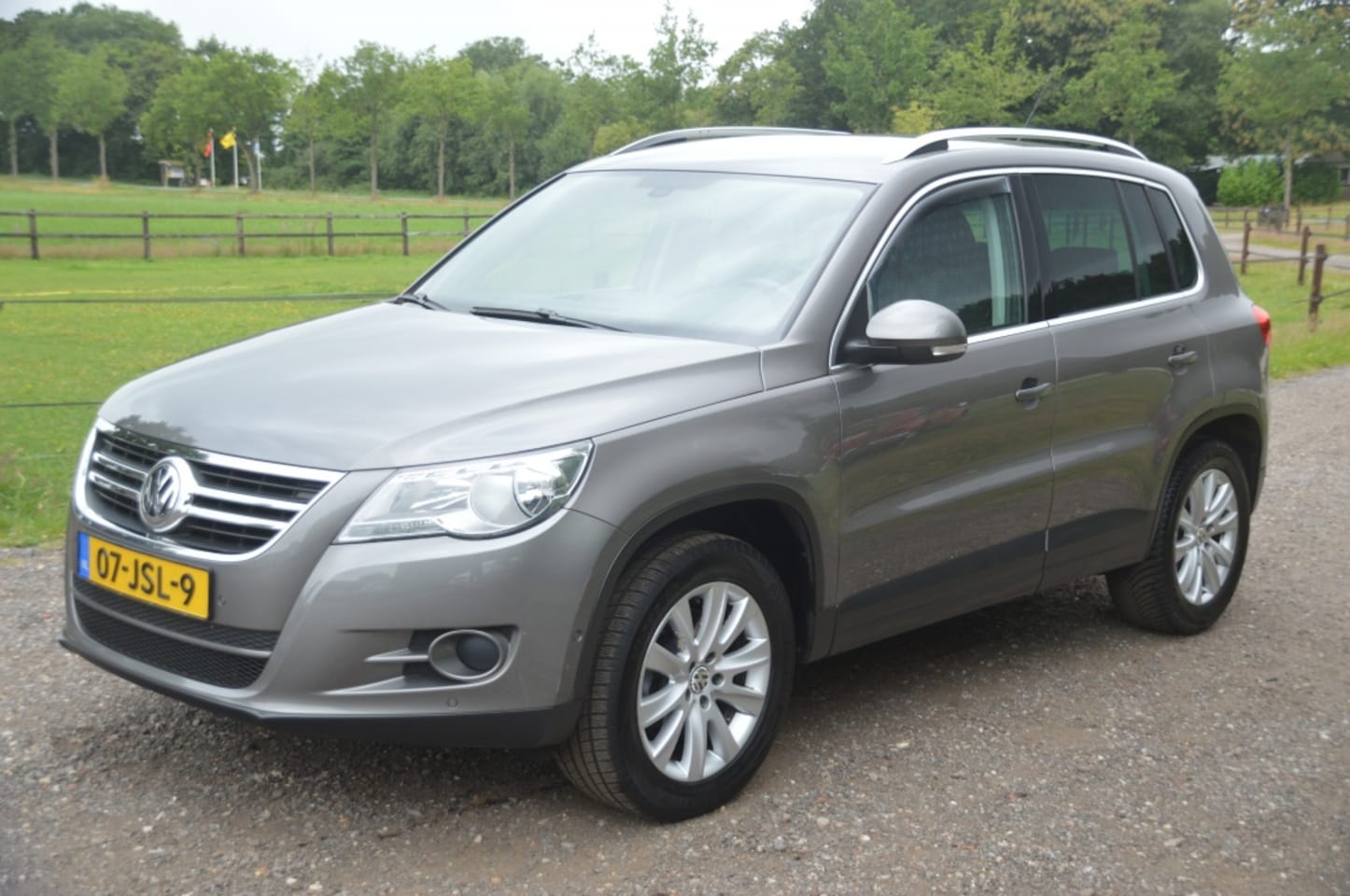 Volkswagen Tiguan - 1.4 TSI Sport&Style Clima Cruise PDC Camera - AutoWereld.nl
