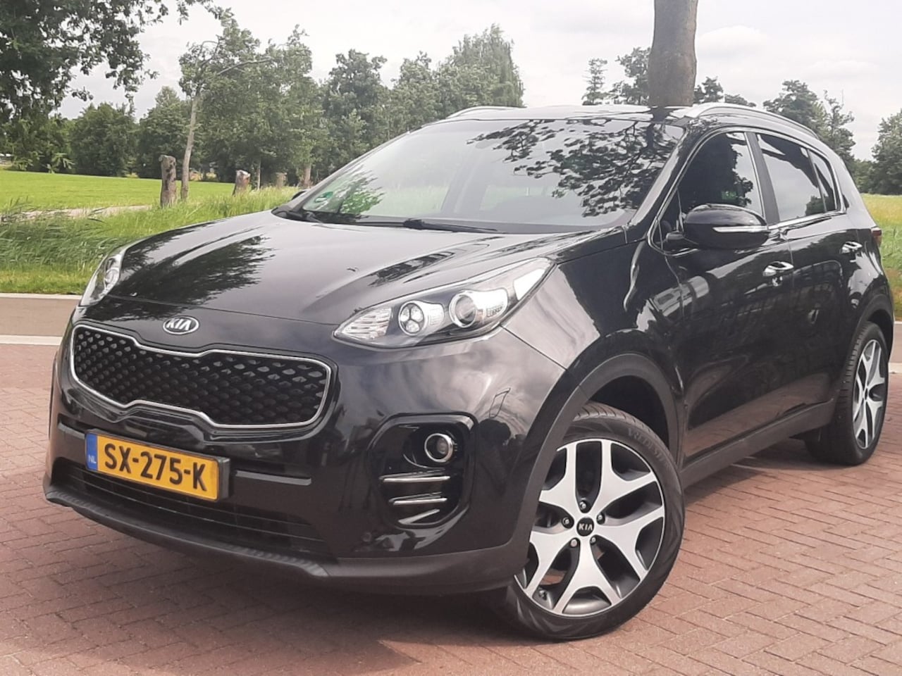 Kia Sportage - 1.6 132pk Airco Cruise-Control Navigatie Bluetooth Stoel- en Stuurverwarming - AutoWereld.nl