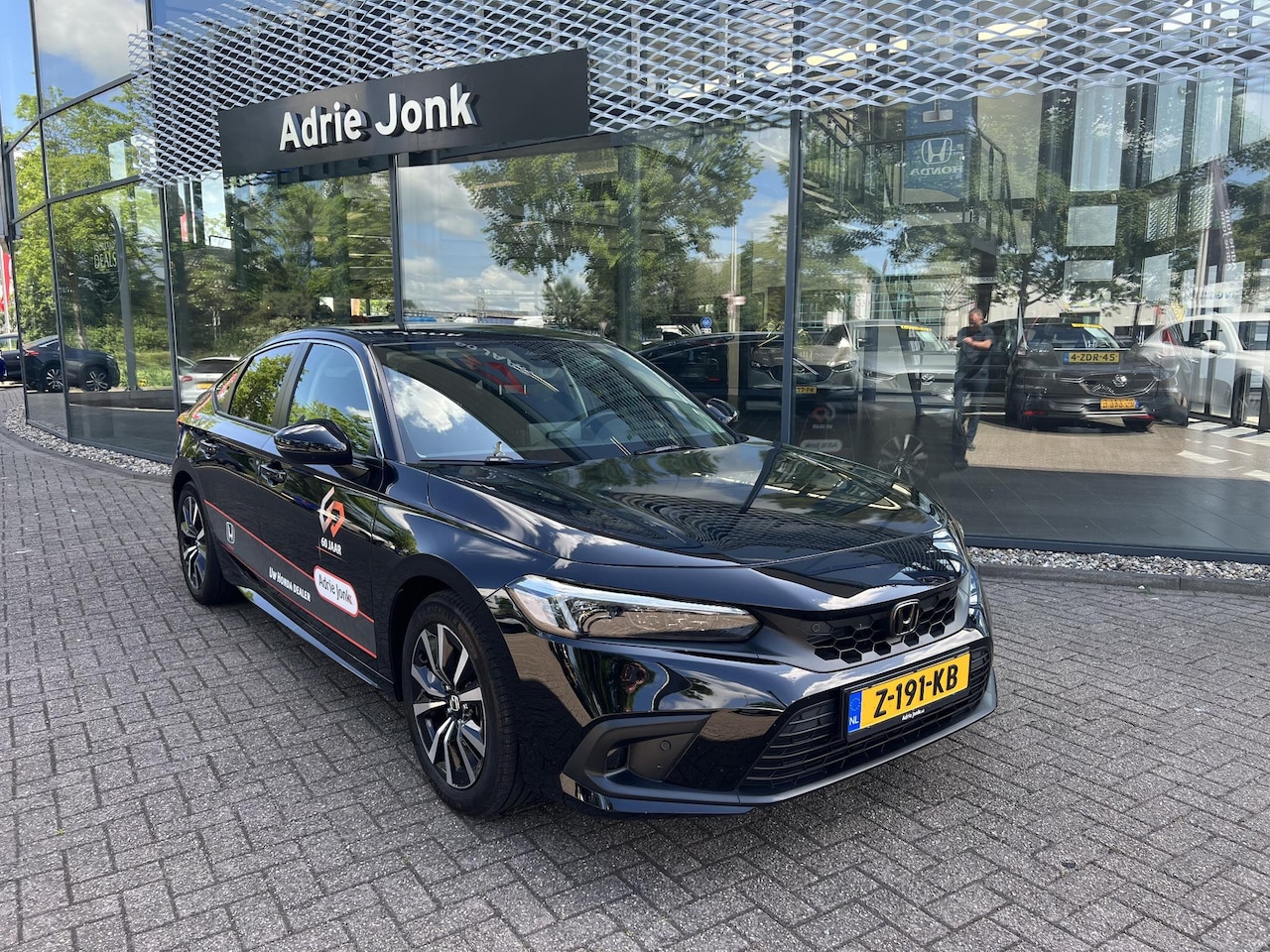 Honda Civic - 2.0 e:HEV Elegance | AUTOMAAT | SPORTPAKKET |  APPLE CARPLAY | ACHTERUITRIJCAMERA | PARKEE - AutoWereld.nl