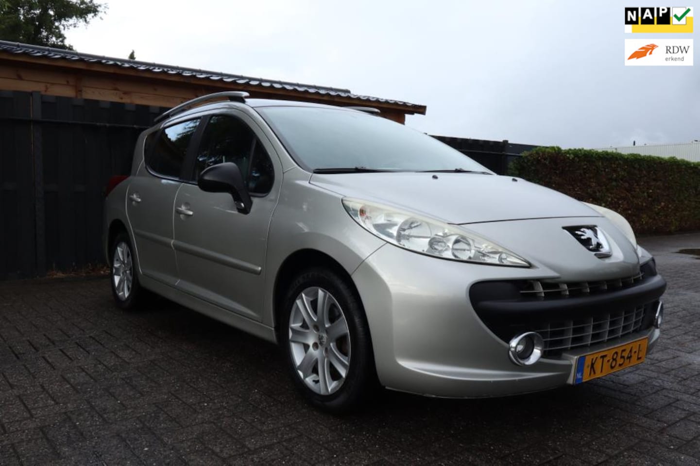 Peugeot 207 SW Outdoor - 1.6 16V SW 2008 Zwart Panorama / Airco / Trekhaak - AutoWereld.nl