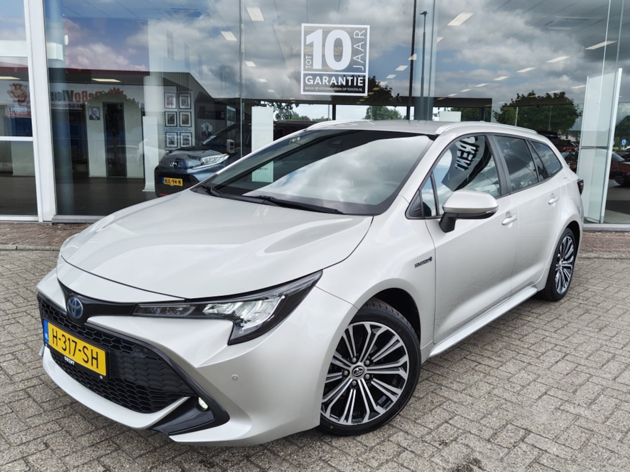 Toyota Corolla Touring Sports - 1.8 Hybrid Business Plus | Trekhaak | Parkeersensoren | Stoelver - AutoWereld.nl