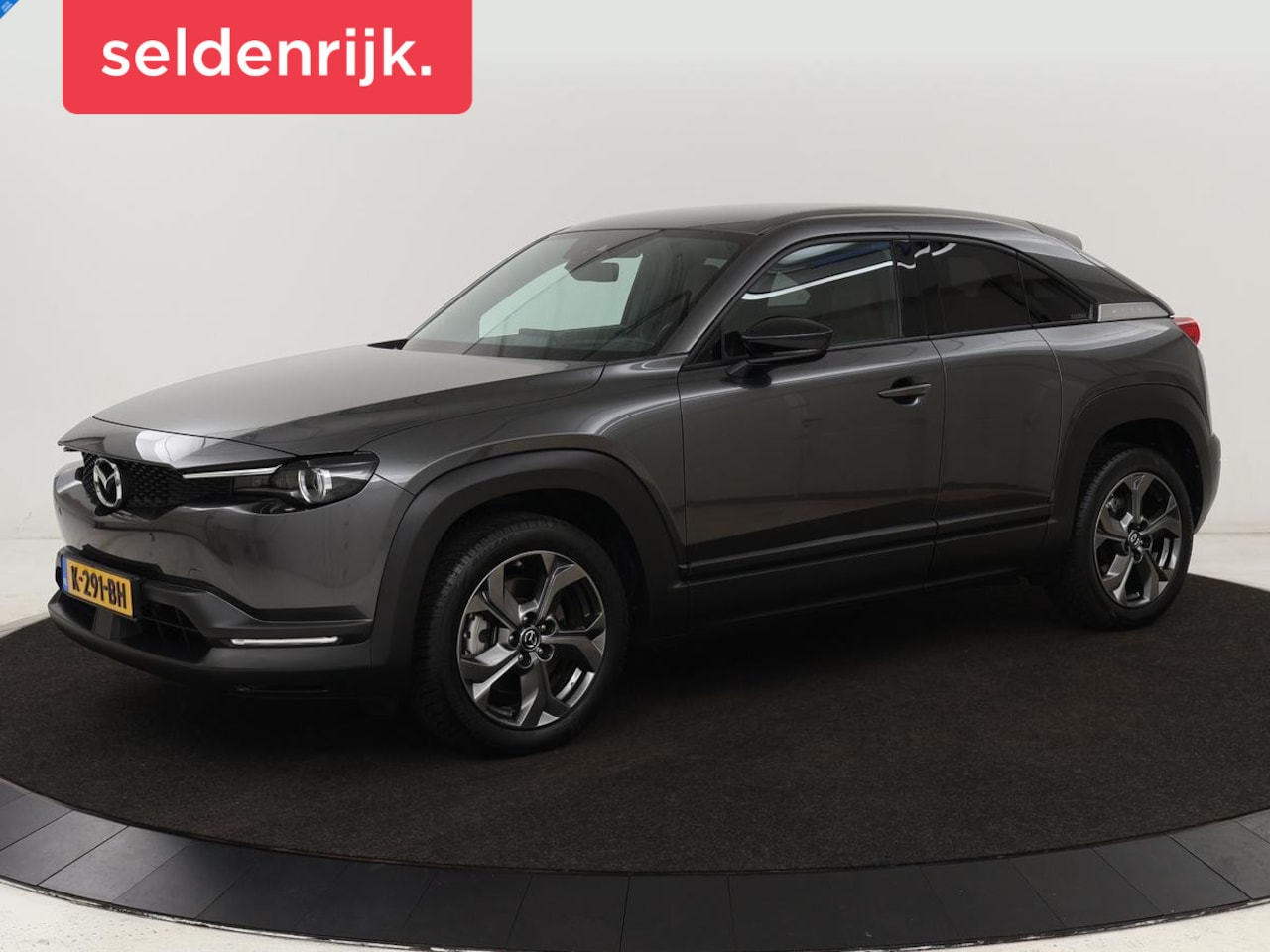 Mazda MX-30 - e-SkyActiv 145 First Edition 36 kWh | Stoelverwarming | Head-Up | Camera | Carplay | Adapt - AutoWereld.nl