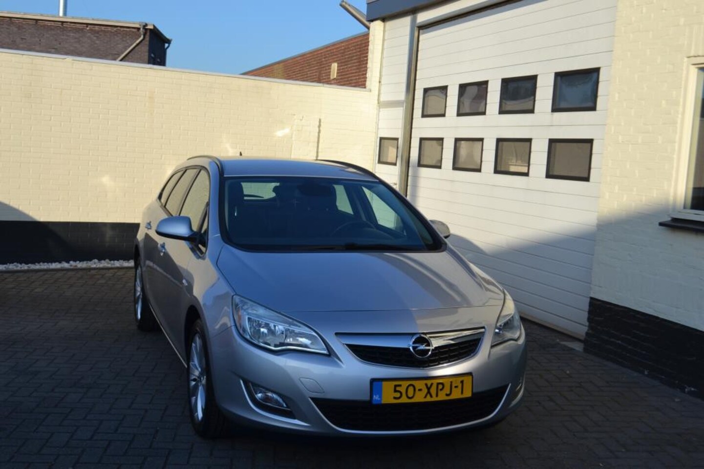 Opel Astra Sports Tourer - 1.4 Turbo Sport Navi/Trekhaak/Half Leder - AutoWereld.nl