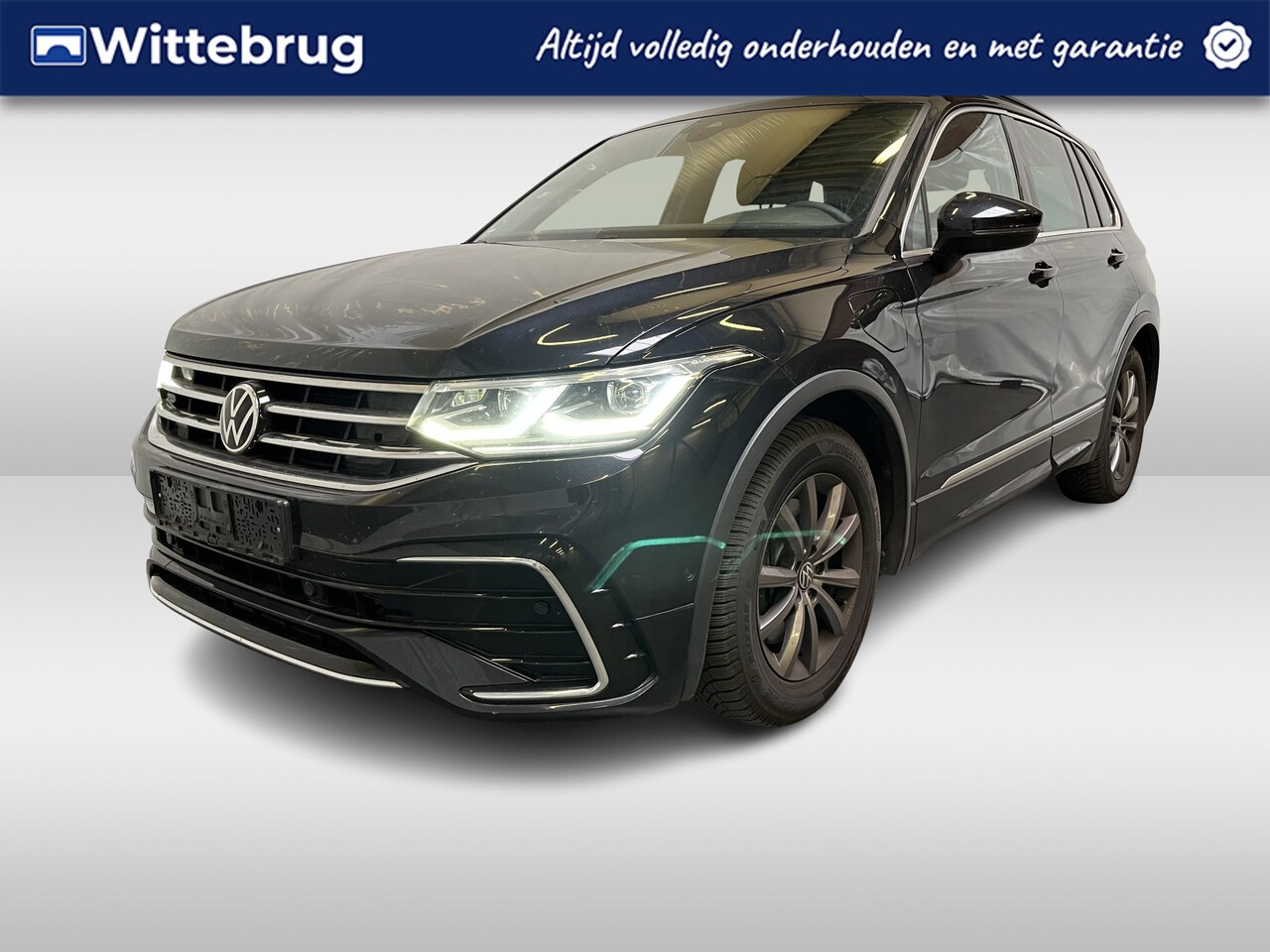 Volkswagen Tiguan - 1.4 TSI eHybrid R-Line / AUTOMAAT/ 245 PK/ ELEKTR. TREKHAAK/ 2X R-LINE/ RIJ-MODI/ DAB/ CLI - AutoWereld.nl