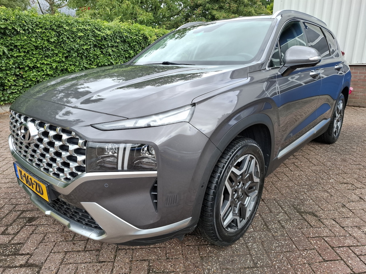 Hyundai Santa Fe - 1.6 T-GDI HEV PREMIUM 7-PERSOONS/LEER/LED/NAVI/360 CAMERA 180PK - AutoWereld.nl