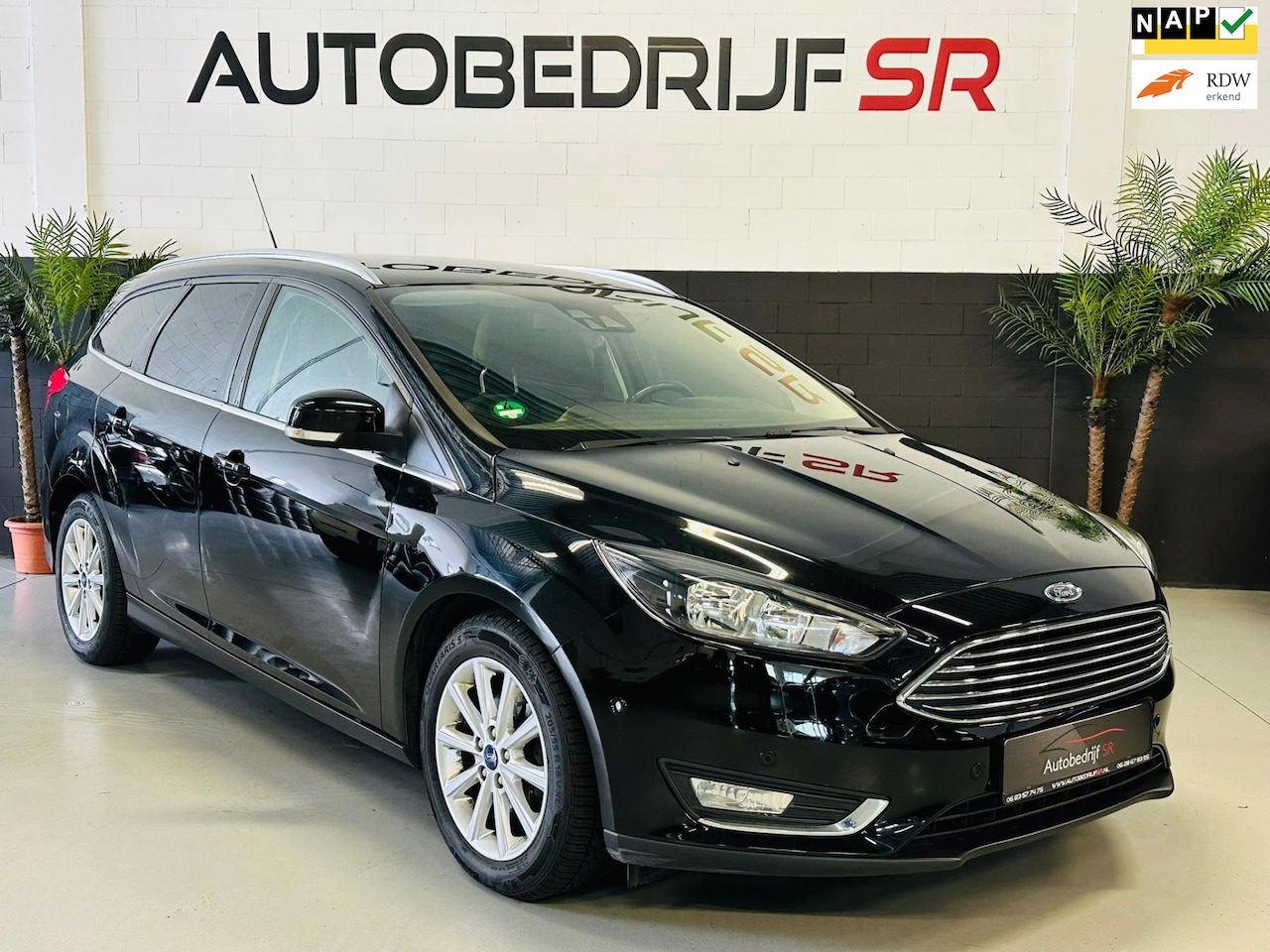 Ford Focus Wagon - 1.0 Titanium Lane Assist! Navigatie! Cruise controle! Elektr Stoelen! Side assist - AutoWereld.nl
