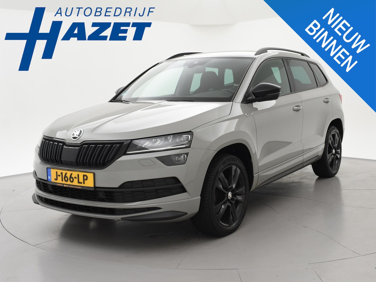 Skoda Karoq - 1.5 TSI ACT 150 PK DSG AUT. SPORTLINE STEEL GREY + VIRTUAL COCKPIT | TREKHAAK | CAMERA | A - AutoWereld.nl