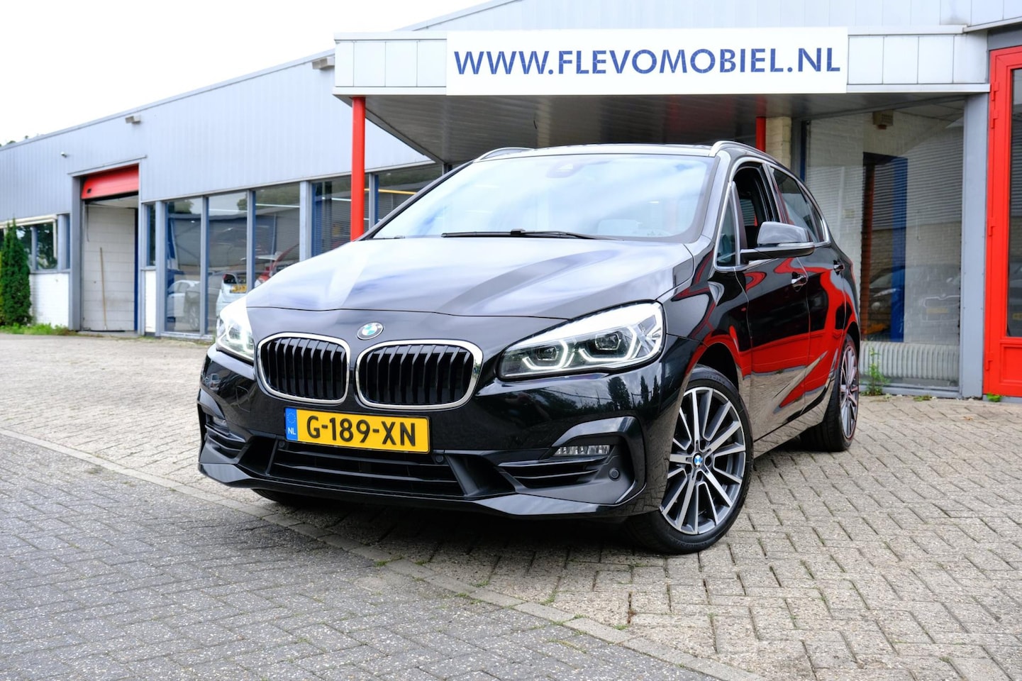 BMW 2-serie Active Tourer - 220i High Executive Edition Aut. Leder|Pano|Navi|Clima - AutoWereld.nl