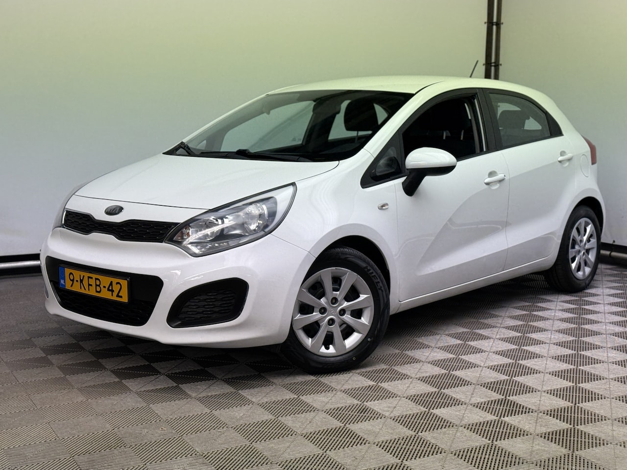 Kia Rio - 1.2 CVVT Comfort Pack 5-drs Navi 1e Eigenaar - AutoWereld.nl
