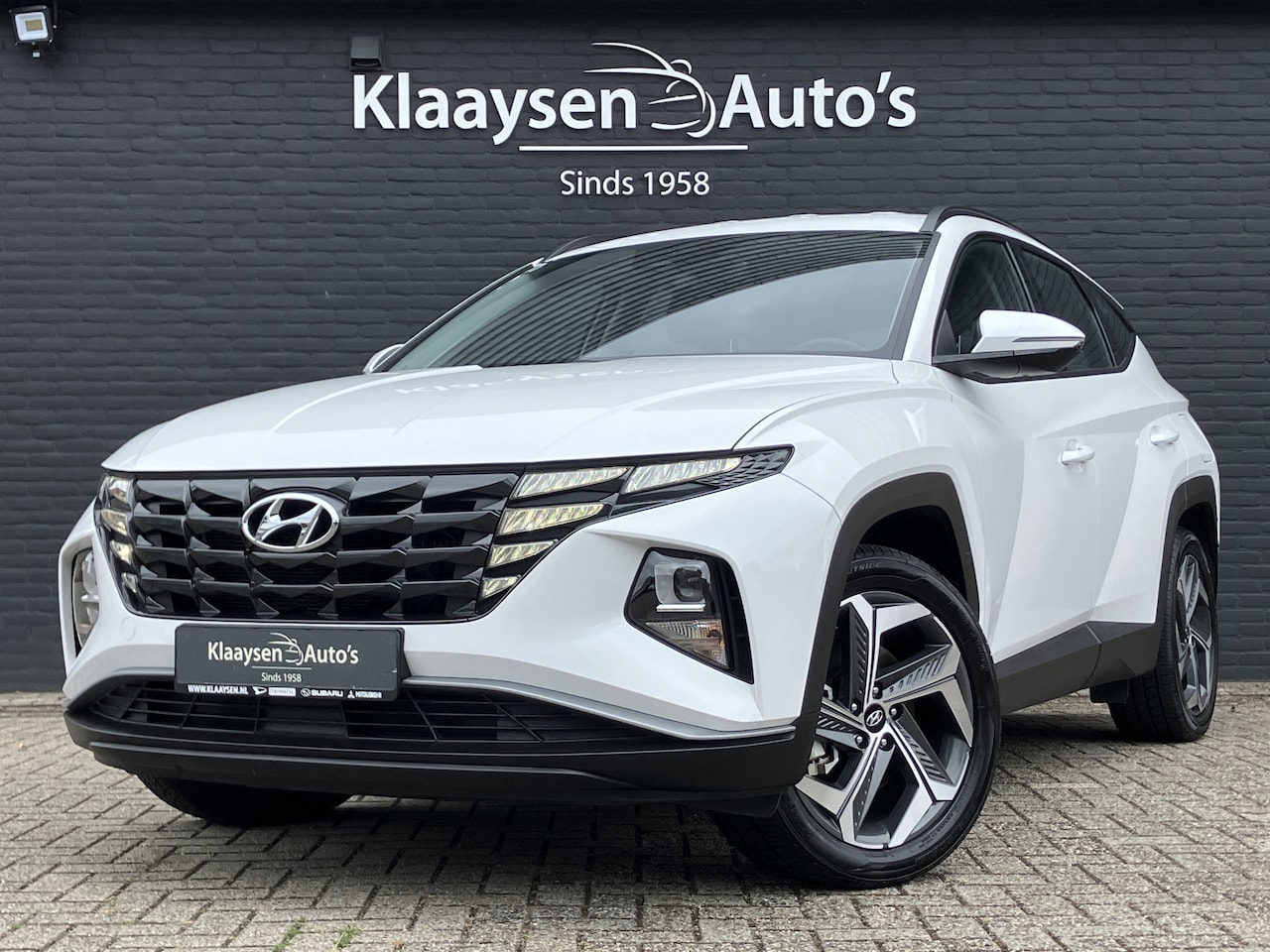 Hyundai Tucson - 1.6 T-GDI PHEV 265 pk Comfort Smart 4WD AUT. | 1e eigenaar | dealer onderh. | trekhaak | c - AutoWereld.nl