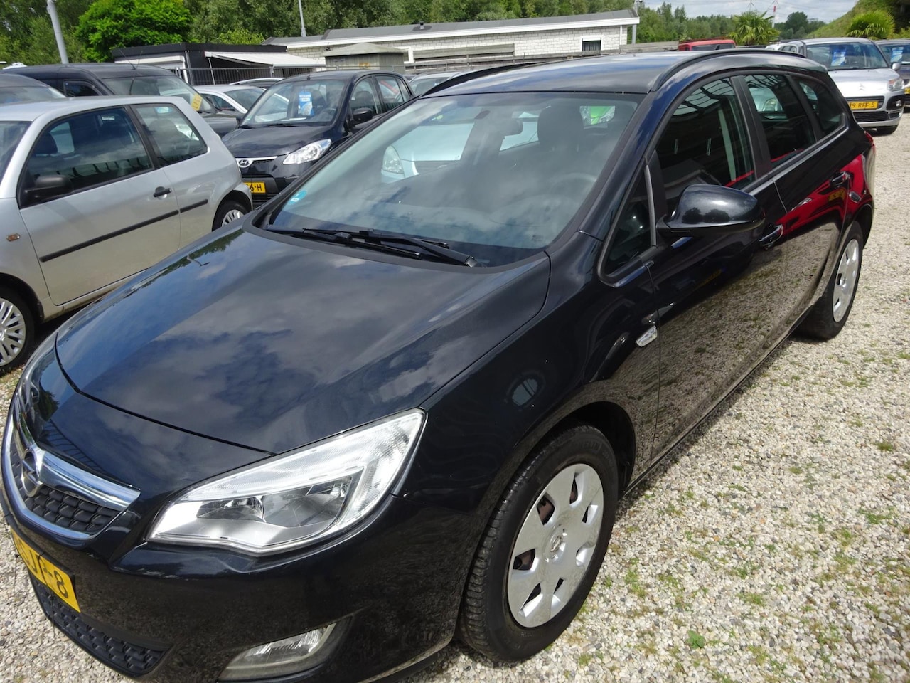 Opel Astra Sports Tourer - 1.4 Turbo Edition navigatie airco trekhaak - AutoWereld.nl