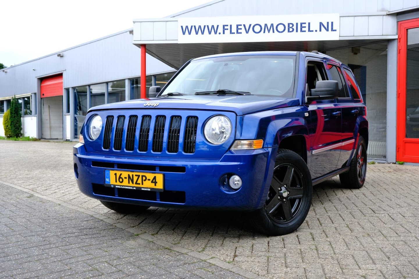 Jeep Patriot - 2.4 AWD Limited Liberty Aut. Leder|Clima|LMV - AutoWereld.nl