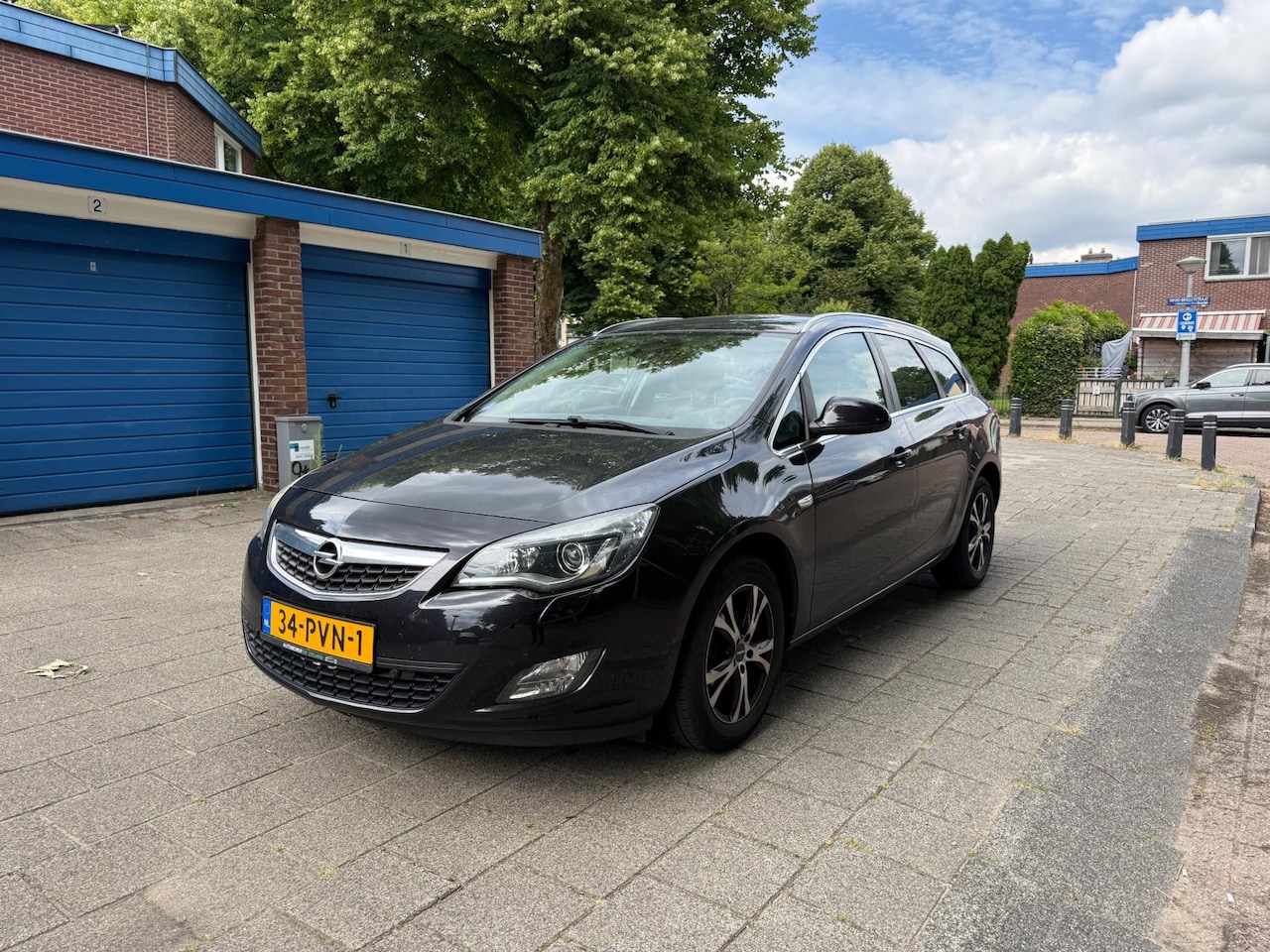 Opel Astra Sports Tourer - 1.4 Cosmo Leder Cruise Airco - AutoWereld.nl