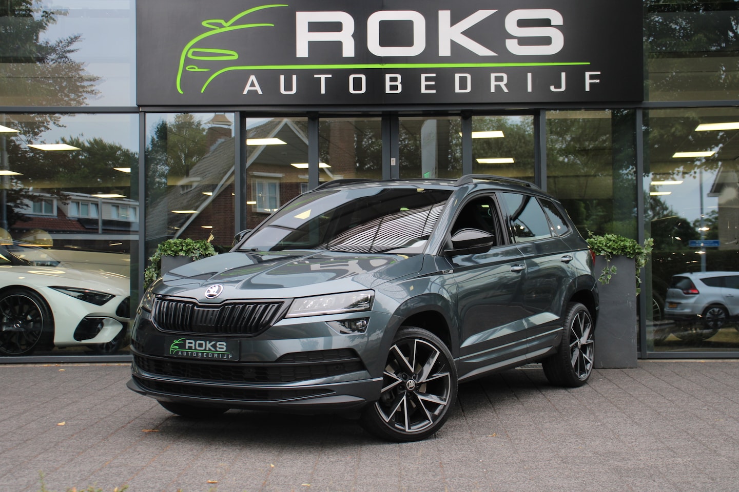 Skoda Karoq - 1.5 TSI ACT Sportline Business Automaat Navi/Camera/Keyless/Virtual/sfeerverlichting/19Inc - AutoWereld.nl