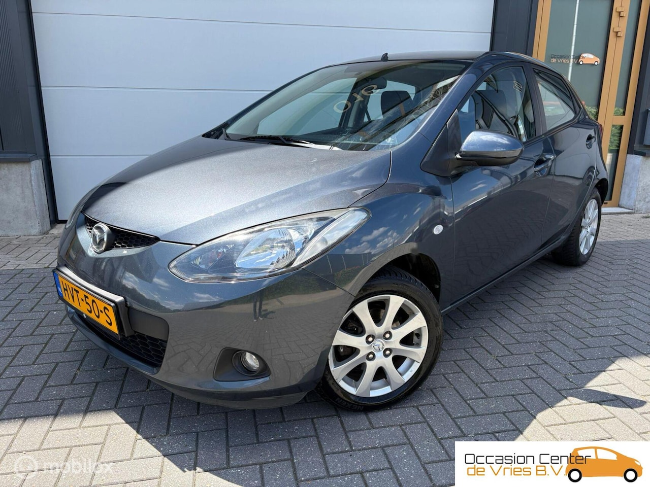 Mazda 2 - 1.3 Airco Navi Carplay Velgen Bluetooth Stoelverwarm - AutoWereld.nl