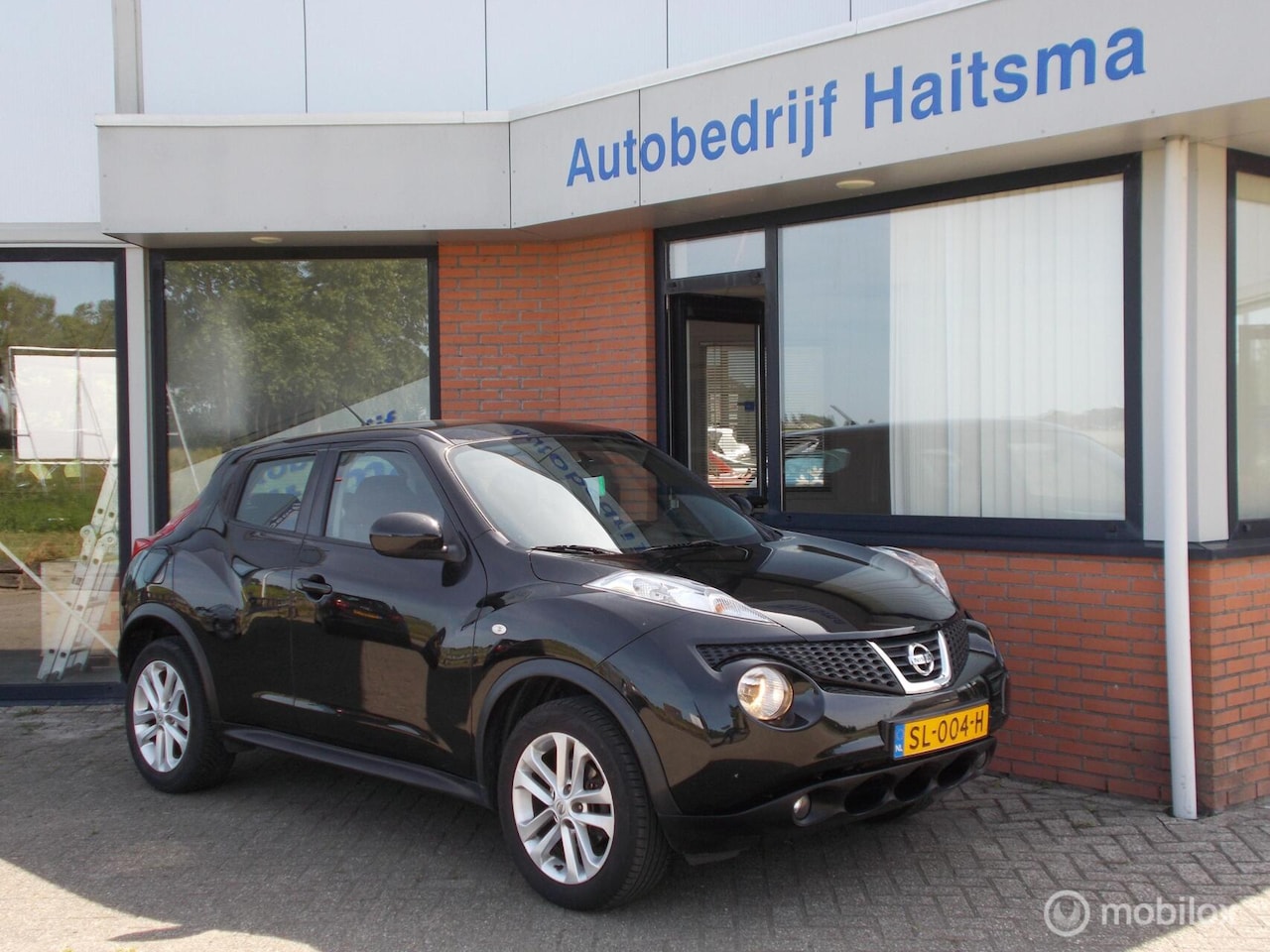 Nissan Juke - 1.6 Acenta Airco | Navi | Cruise control - AutoWereld.nl