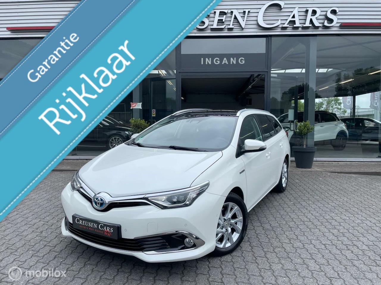 Toyota Auris - 1.8 Hybrid Comfort/Led/Navi/Bt/Parkass./Pano/ - AutoWereld.nl