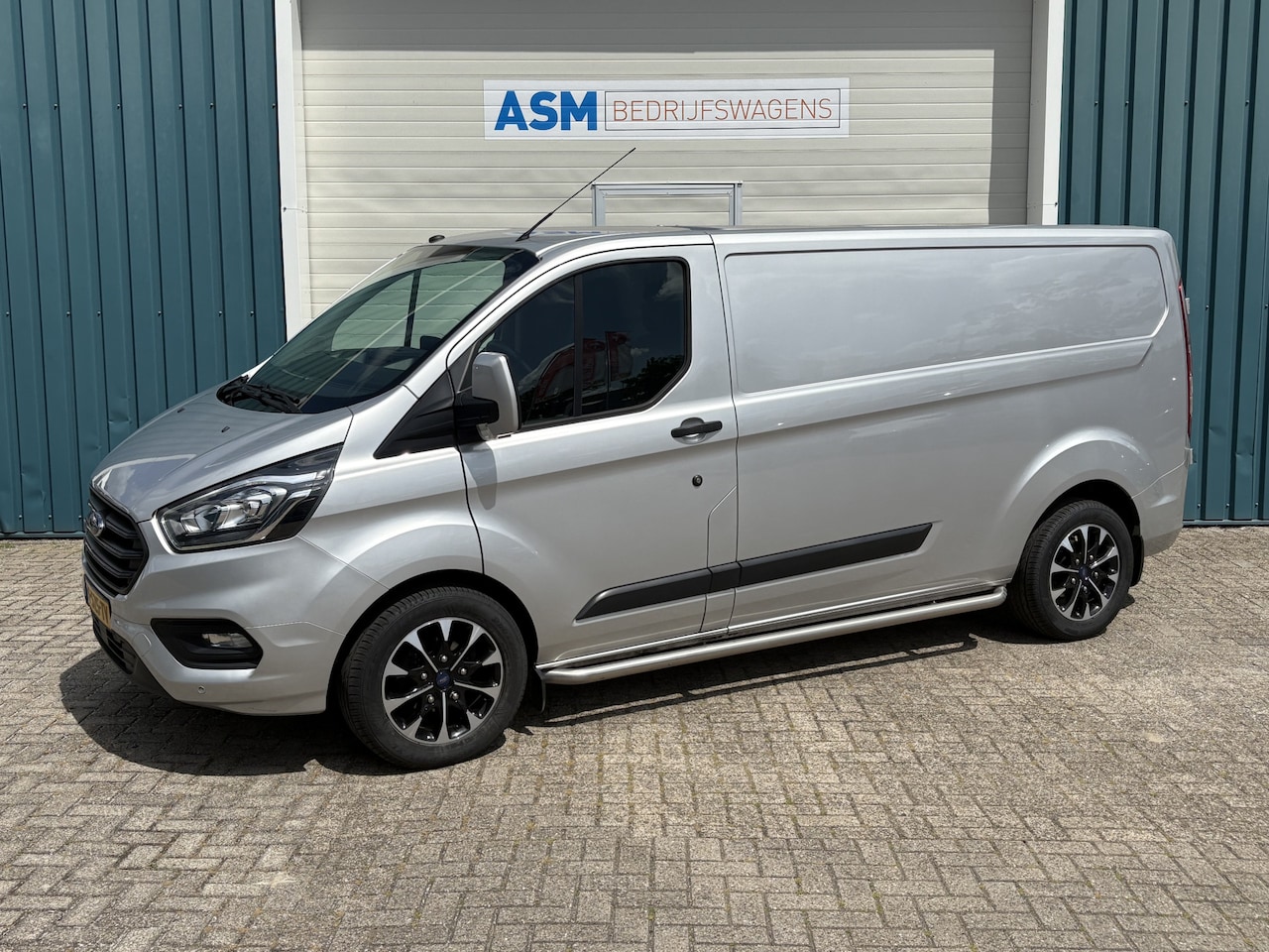 Ford Transit Custom - 300 2.0 131Pk TDCI L2H Trend / Cruise / Airco / Navi / Trekhaak / Apk t/m 25-04-2026 - AutoWereld.nl