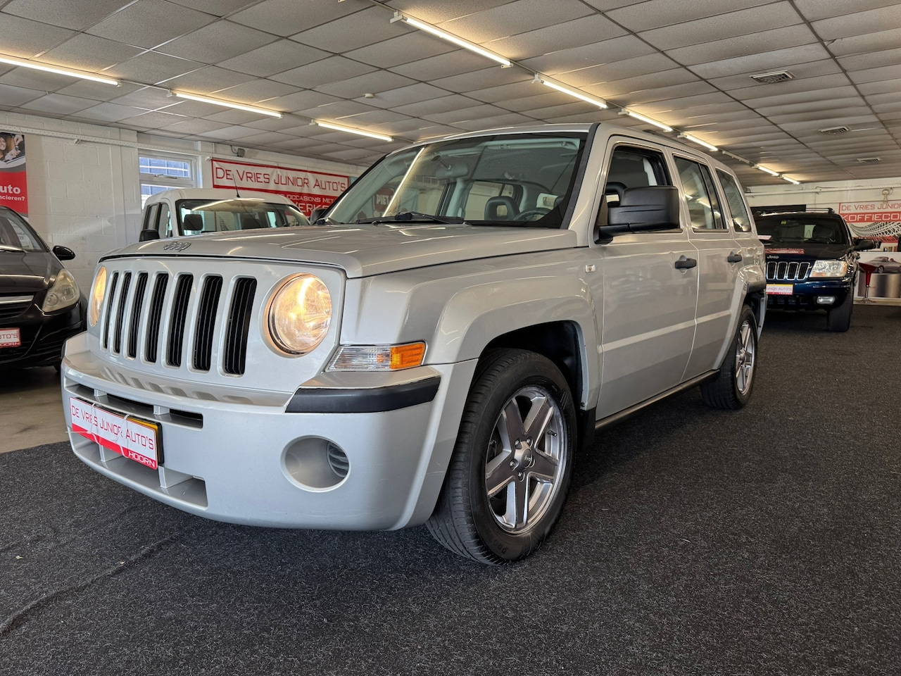 Jeep Patriot - 2.4 Sport Adventure 4X4. Youngtimer, trekhaak, airco en veel meer! - AutoWereld.nl