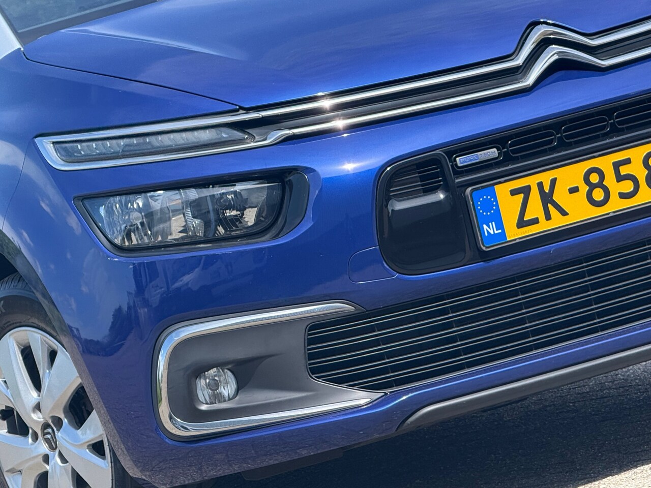 Citroën Grand C4 Picasso - 1.2 PureTech Shine 7pers Automaat - Lazuli Bleu - 70dkm - AutoWereld.nl
