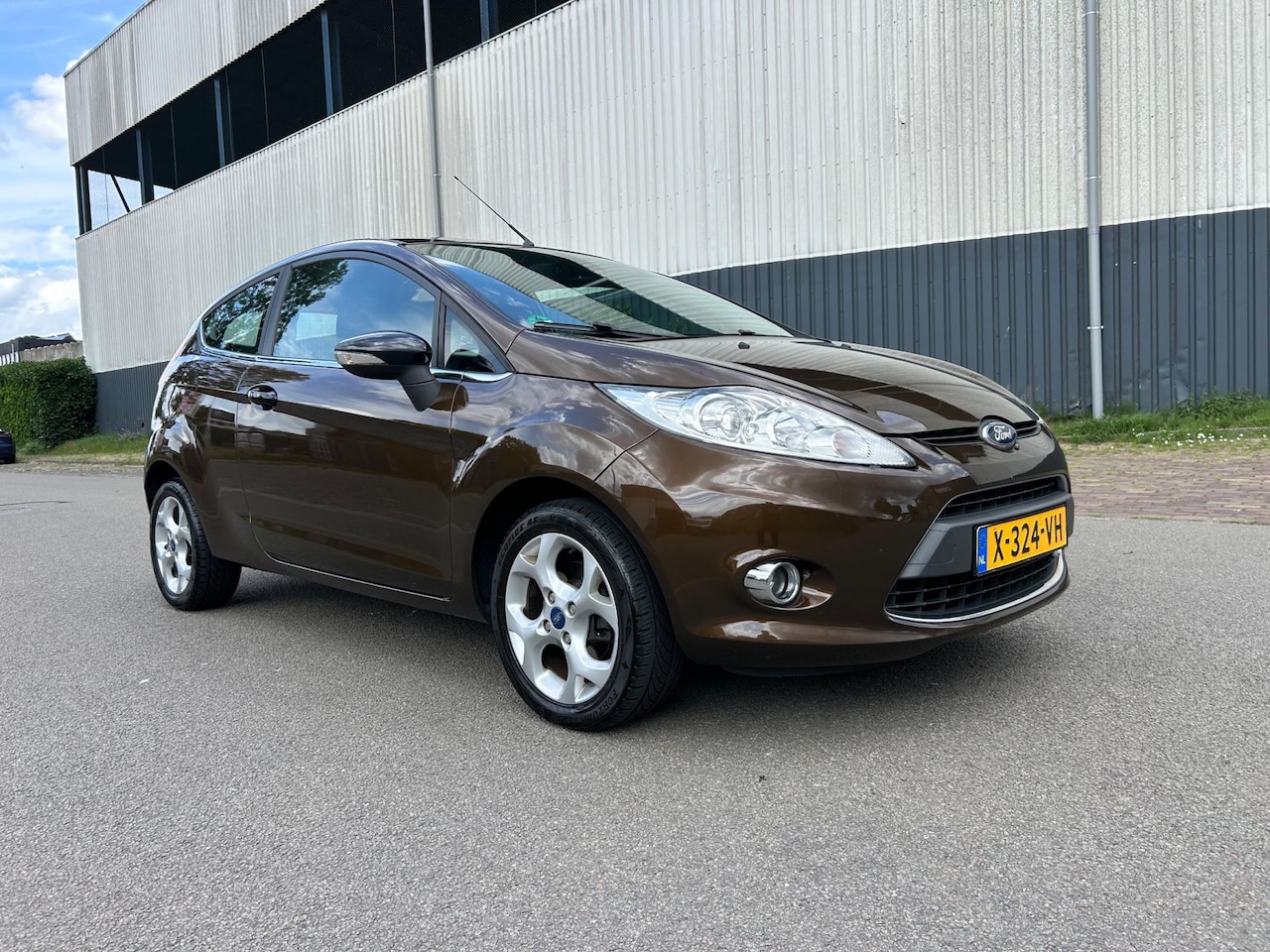 Ford Fiesta - 1.4 Ghia Stoelverwarming/Bluetooth/Airco/Pdc - AutoWereld.nl