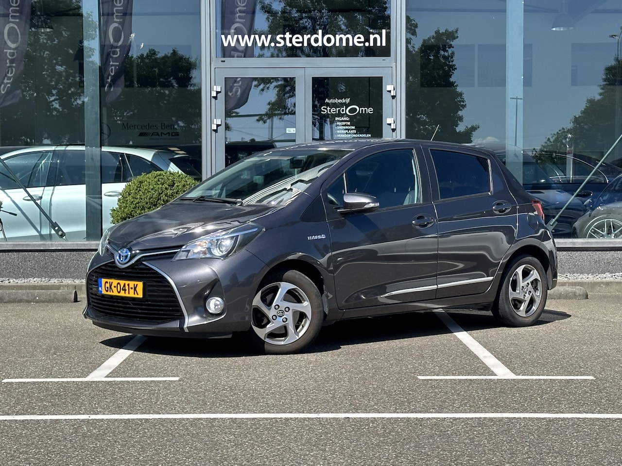 Toyota Yaris - 1.5 Hybrid Lease I Camera I Automaat I Airco l Navigatie I Zeer gunstige KM stand! - AutoWereld.nl