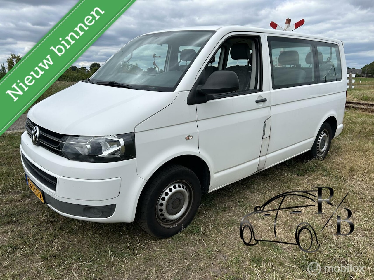 Volkswagen Transporter Kombi - 2.0 TDI L1H1 Trendline 8 PERS AIRCO - AutoWereld.nl