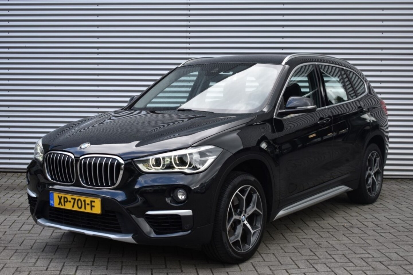 BMW X1 - SDRIVE20I ORANGE ED. III / 1e EIGENAAR / LEDER / HEAD UP / P.CAM - AutoWereld.nl