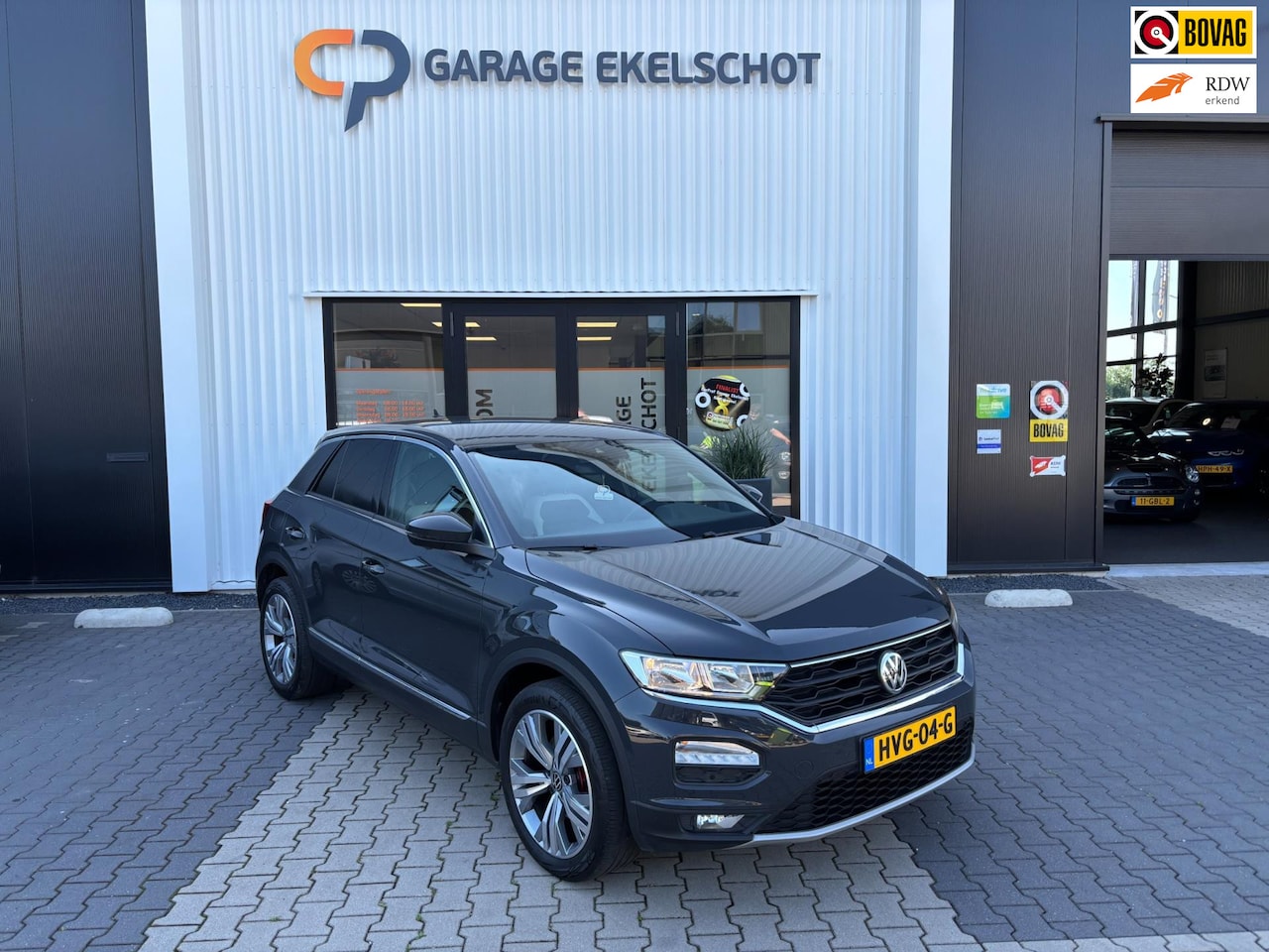 Volkswagen T-Roc - 1.5 TSI Sport / Camera / Carplay / Navi / Stoelverwarming - AutoWereld.nl