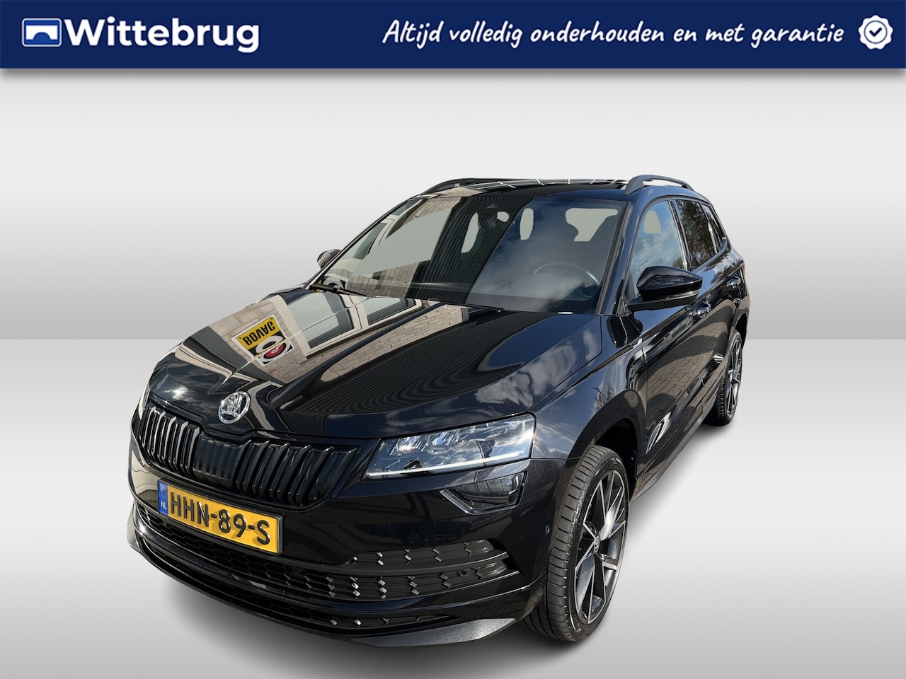 Skoda Karoq - 1.5 TSI ACT Sportline Business / AUTOMAAT/ PANO/ STANDKACHEL/ PARK. SENSOREN/ STOELVERWARM - AutoWereld.nl