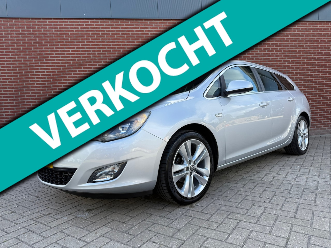 Opel Astra Sports Tourer - 1.4 Turbo Sport / NAP / Cruise / Airco / PDC - AutoWereld.nl