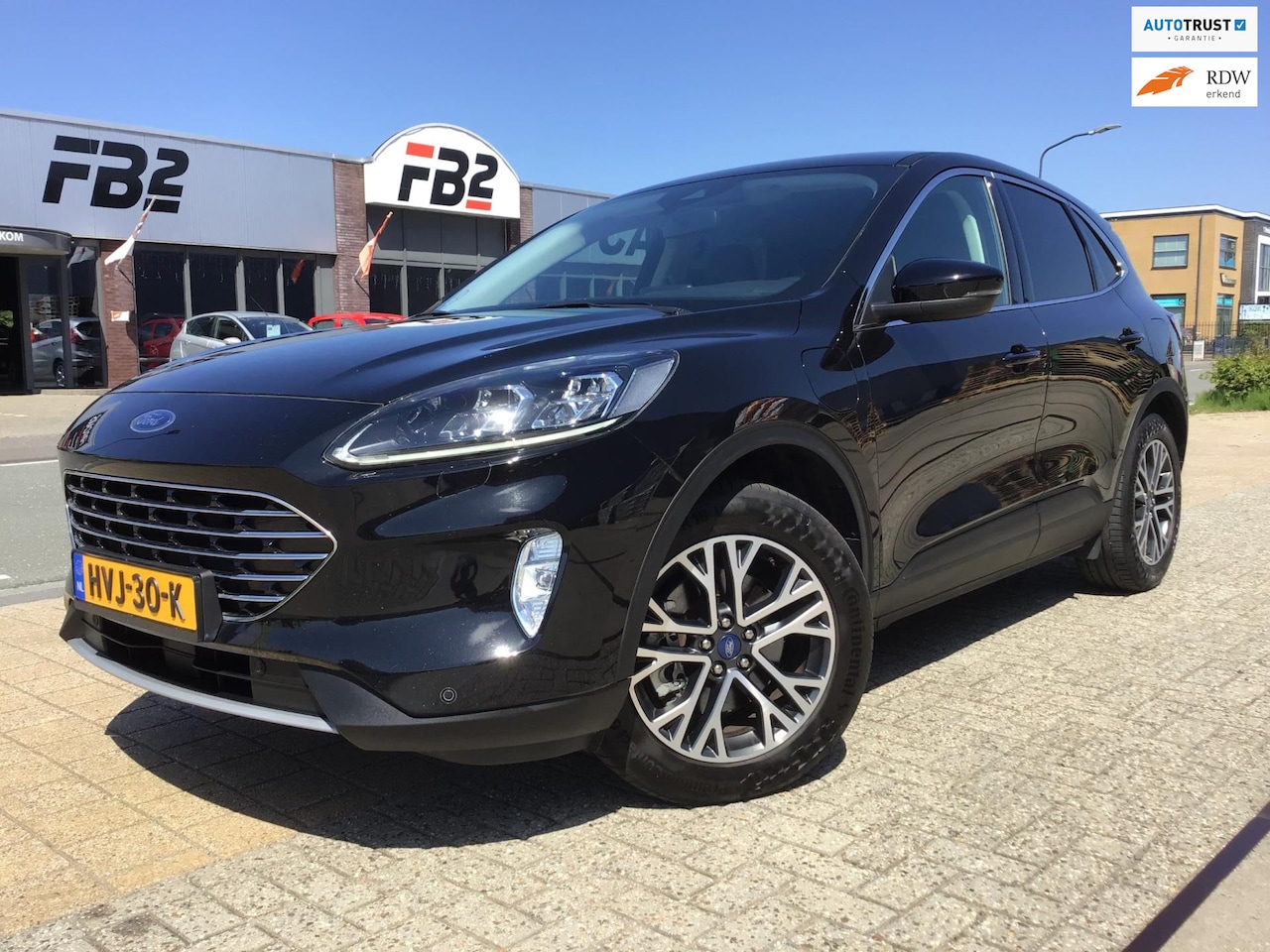 Ford Kuga - 2.5 PHEV Titanium I Trekhaak I B&O I Stoelverw I Navi I Carplay I Half/Leder I Keyless I D - AutoWereld.nl