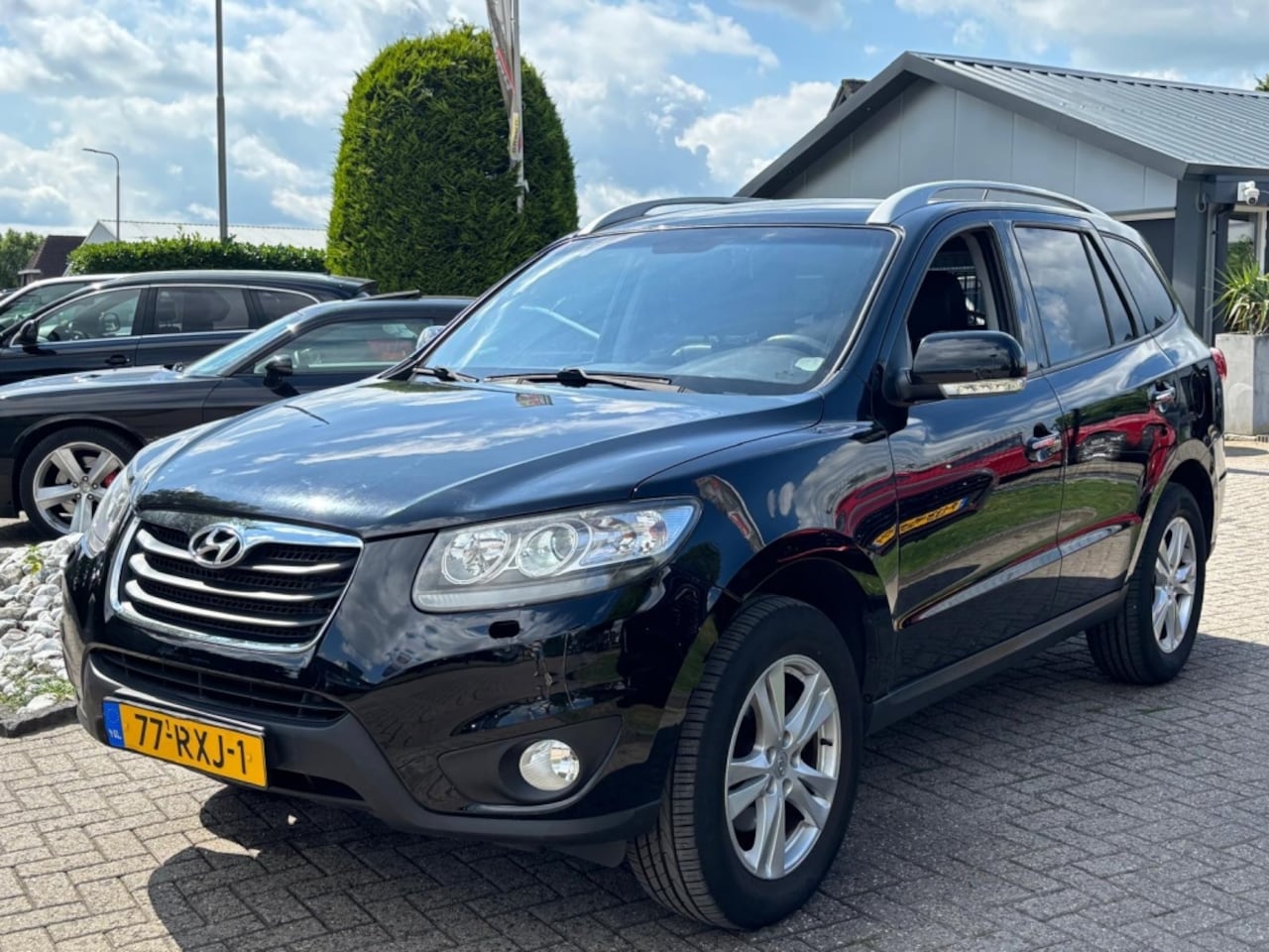 Hyundai Santa Fe - 2.2 CRDi 4WD Automaat Style Zwart 2010 - AutoWereld.nl