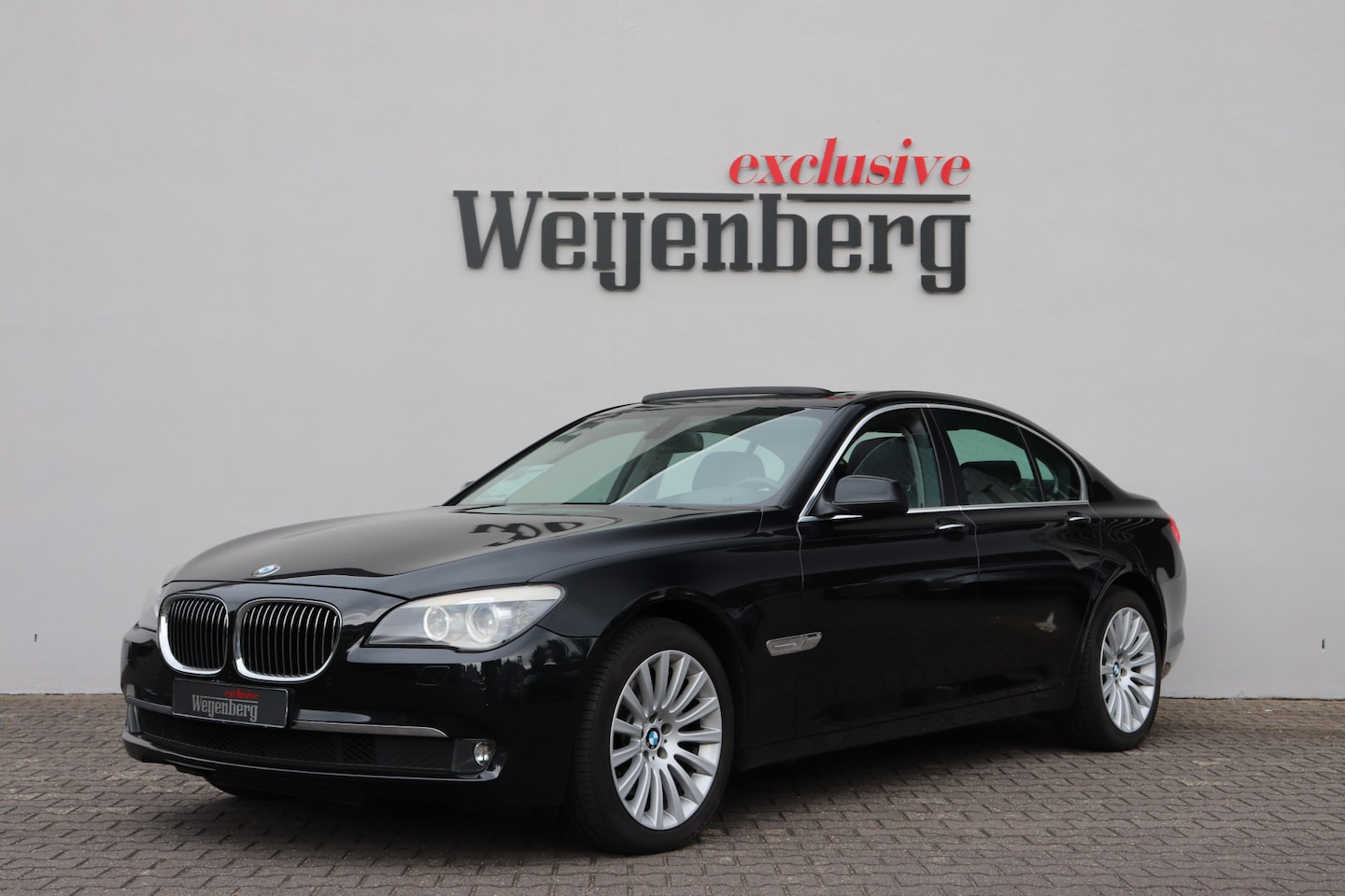 BMW 7-serie - 740i High Executive Pano Zwart Leder - AutoWereld.nl