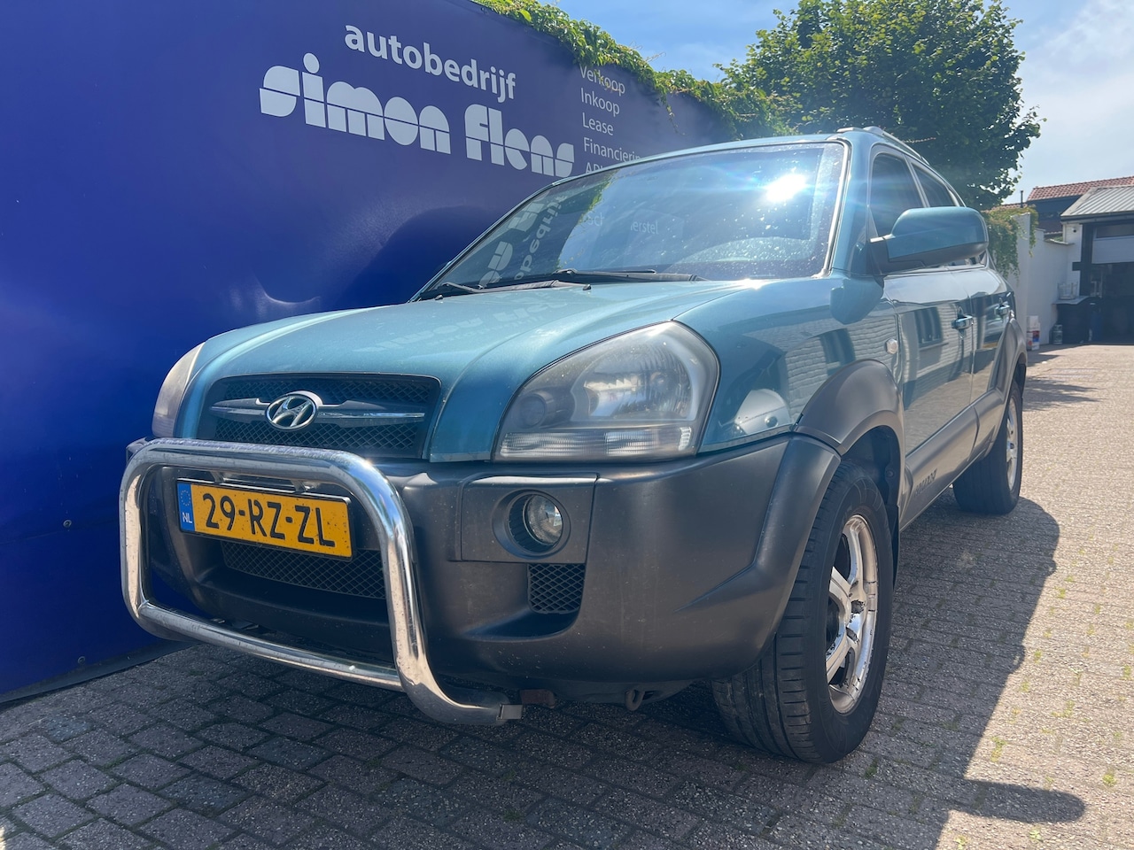 Hyundai Tucson - 2.0i Dynamic*AIRCO* - AutoWereld.nl