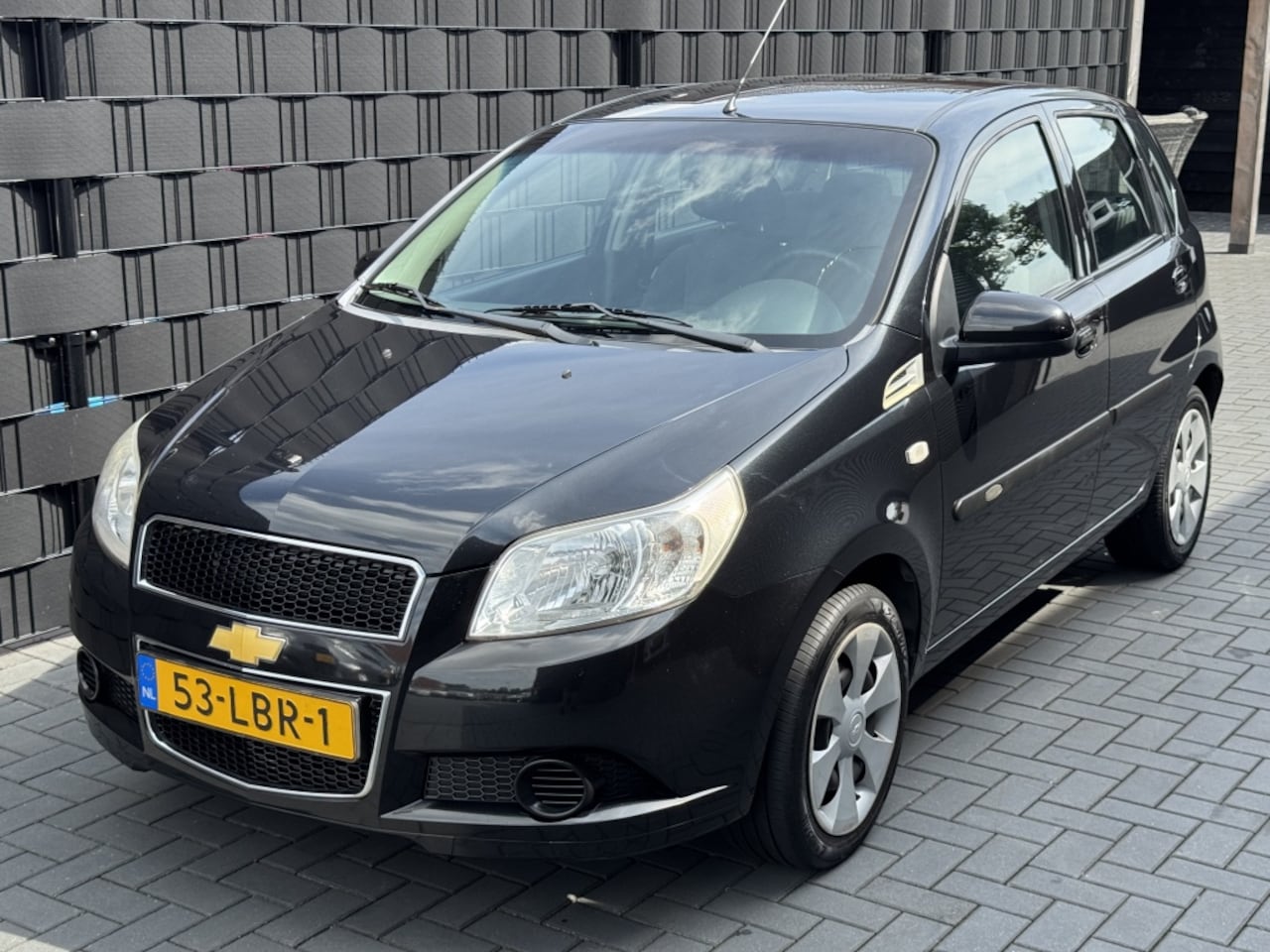 Chevrolet Aveo - 1.2 16V LS B-clever| 2010| ZWART| 5DRS| AIRCO| TREKHAAK - AutoWereld.nl