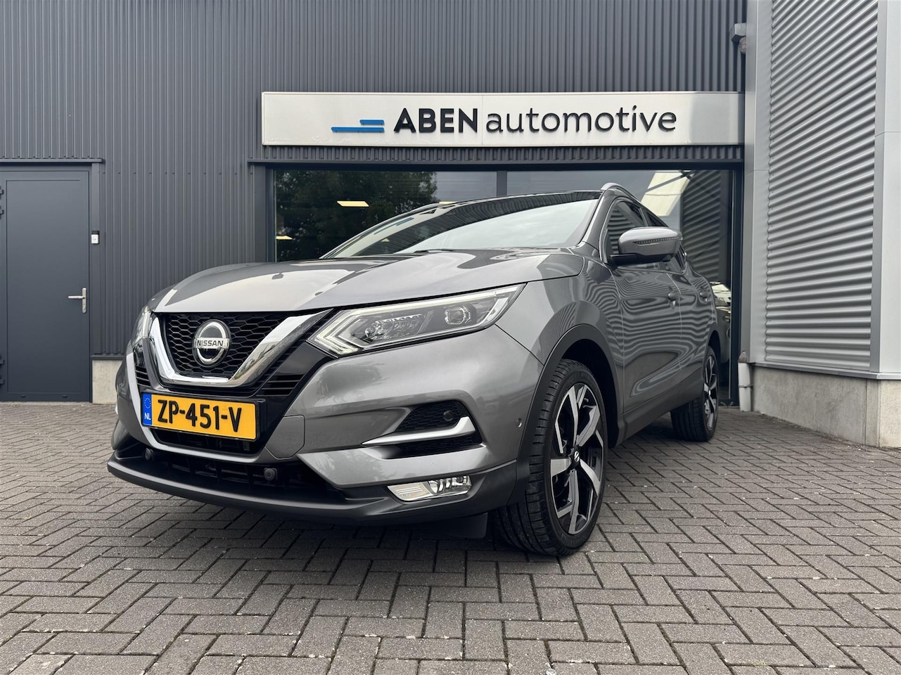 Nissan Qashqai - 1.2 116PK Tekna Automaat (PANO|360|19"|KEYLESS) - AutoWereld.nl
