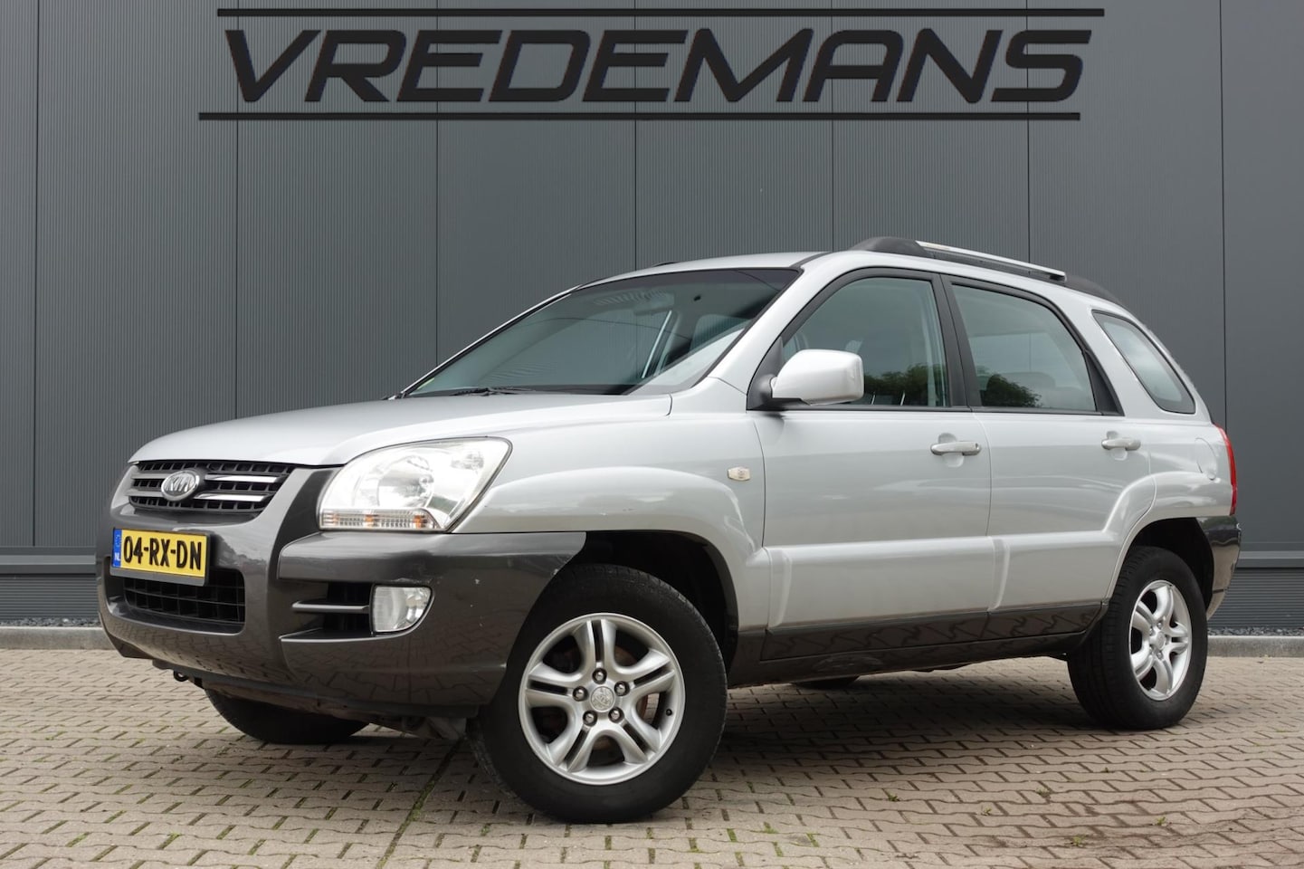 Kia Sportage - 2.0 CVVT Executive 2.0 CVVT Executive - AutoWereld.nl