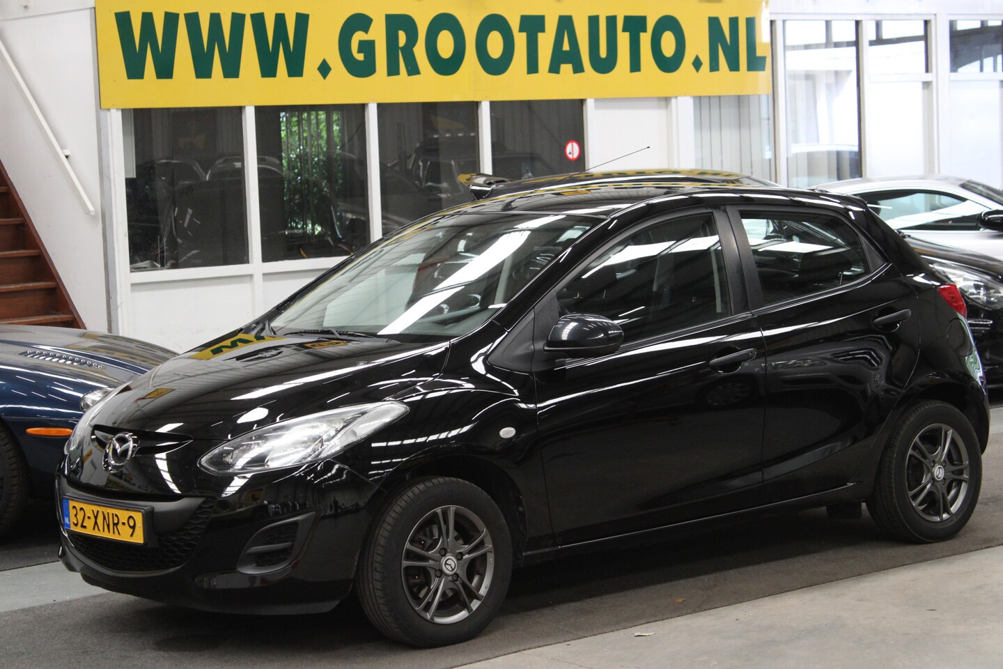 Mazda 2 - 1.3 Cool NAP, Airco, Cruise control, Trekhaak - AutoWereld.nl